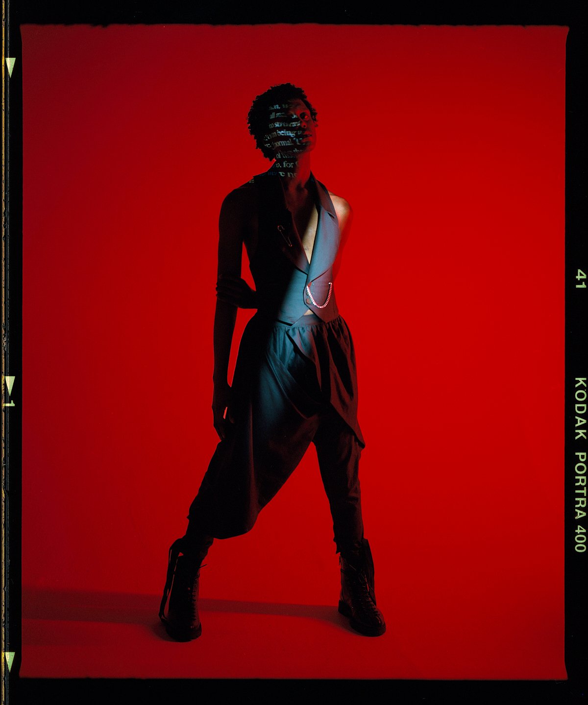 Fashion campaign photography on a red set