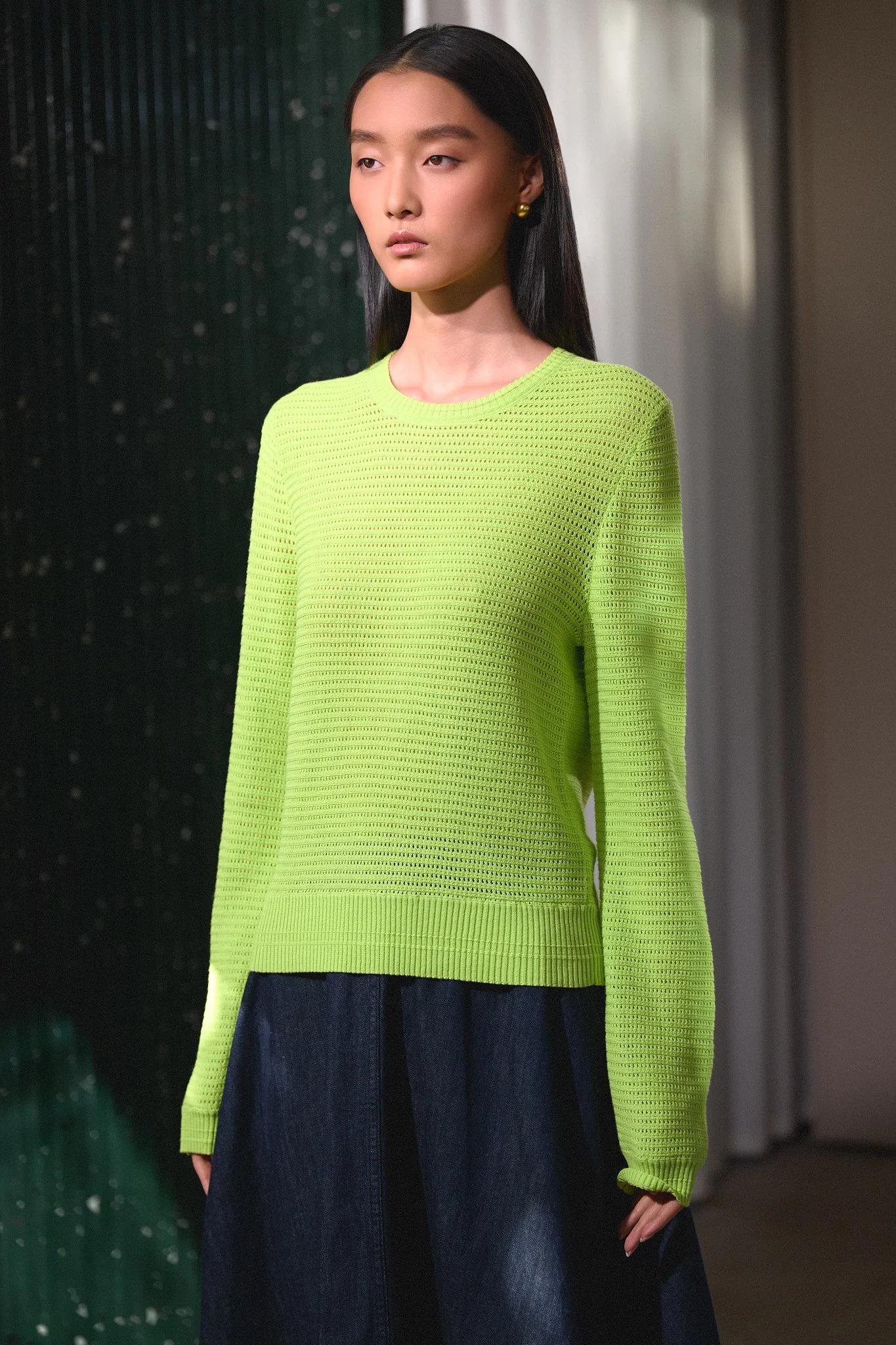 Knitwear lookbook portrait shot on a dark set