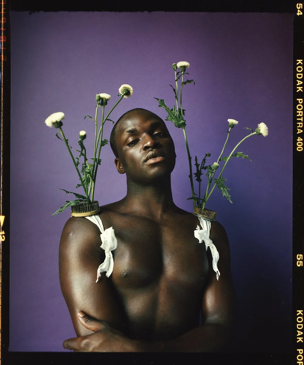 Studio portrait with calla lilies on a purple background