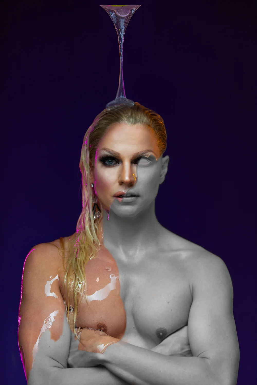 Drag portrait: Courtney Act in soft violet light with blonde hair swept back.