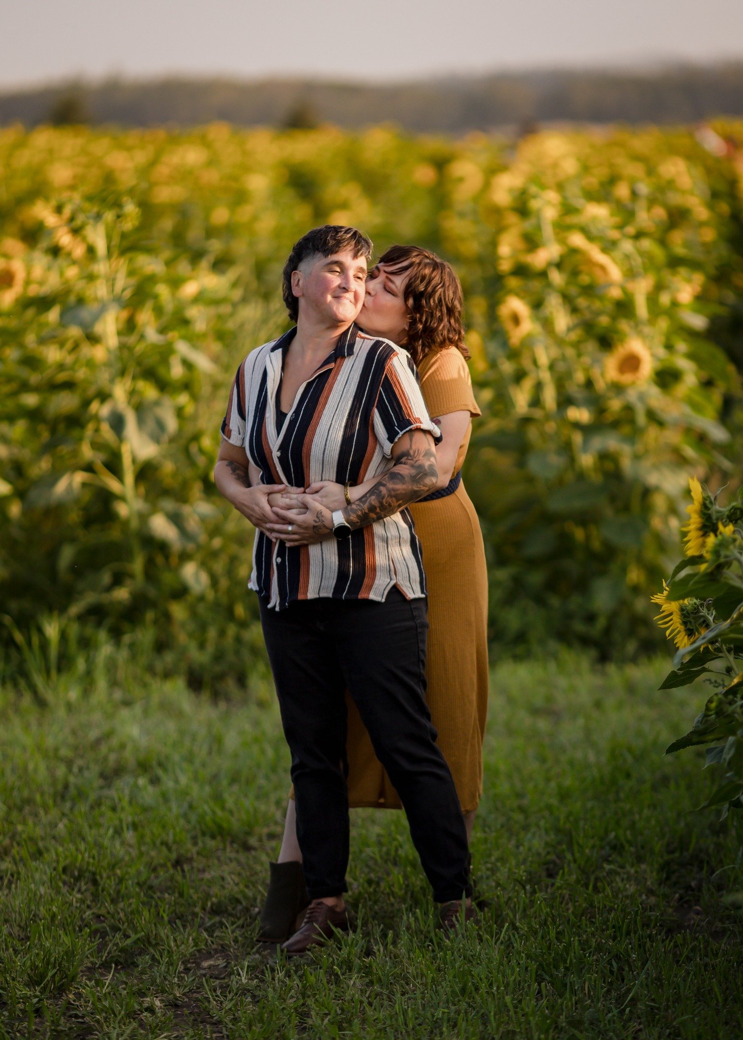 Patrice and her girlfriend Ali together in a sunflower field