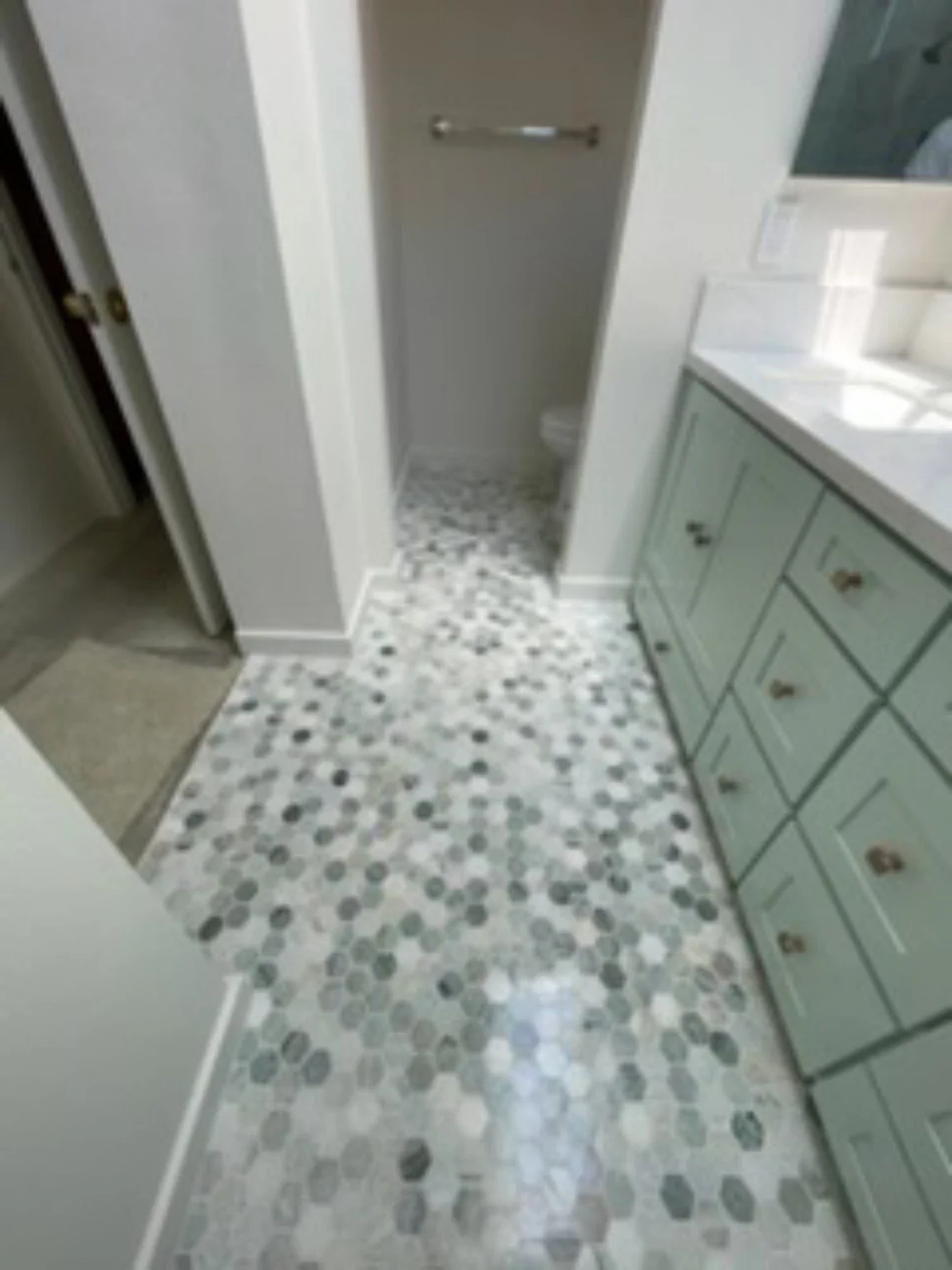 Completed bathroom flooring and vanity detail