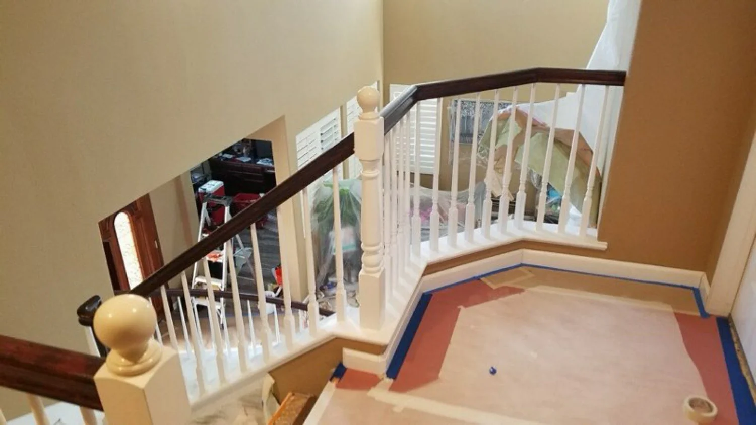 Stair railing and trim detail during finish preparation