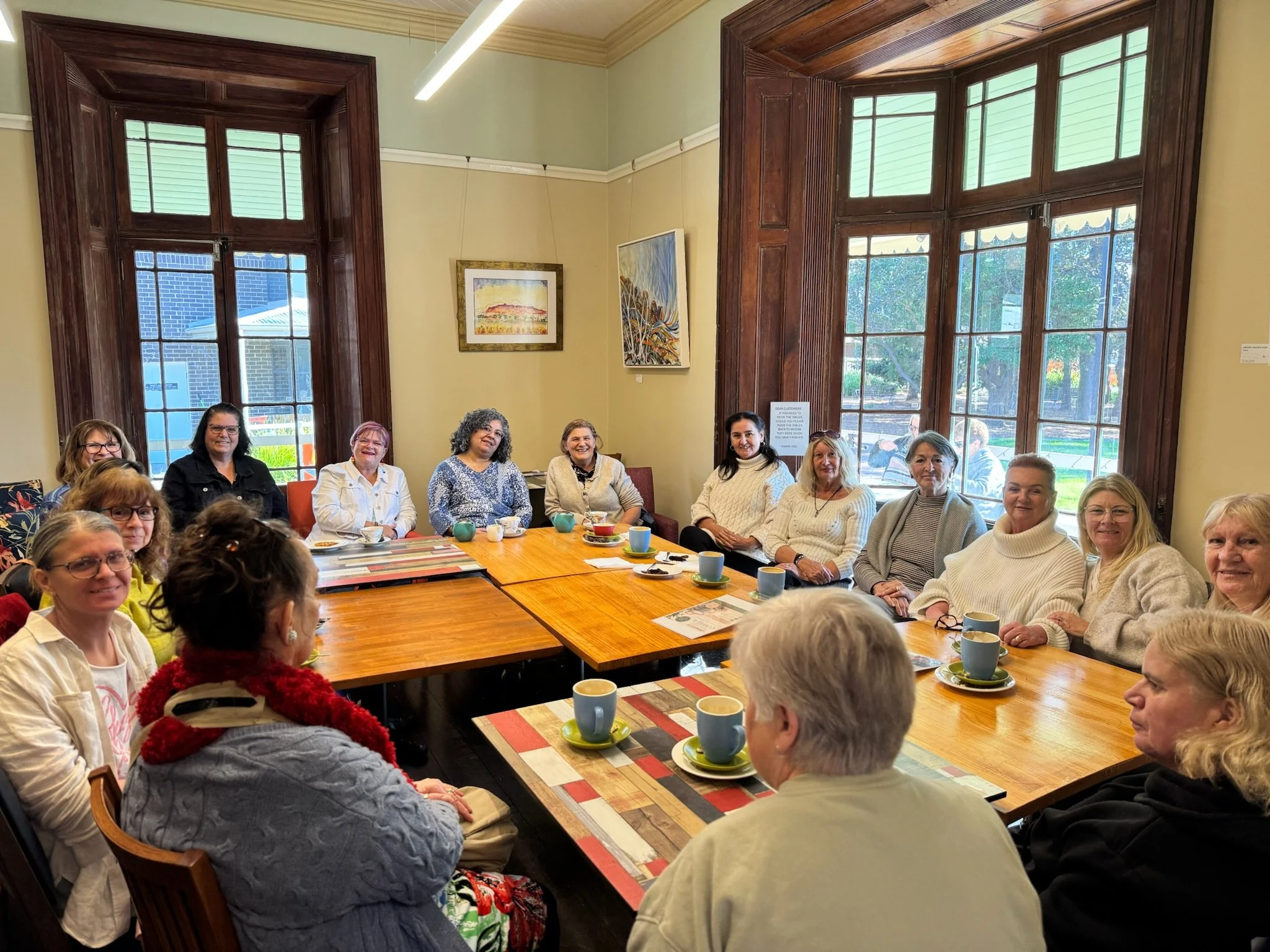 Another view of the group enjoying coffee and conversation