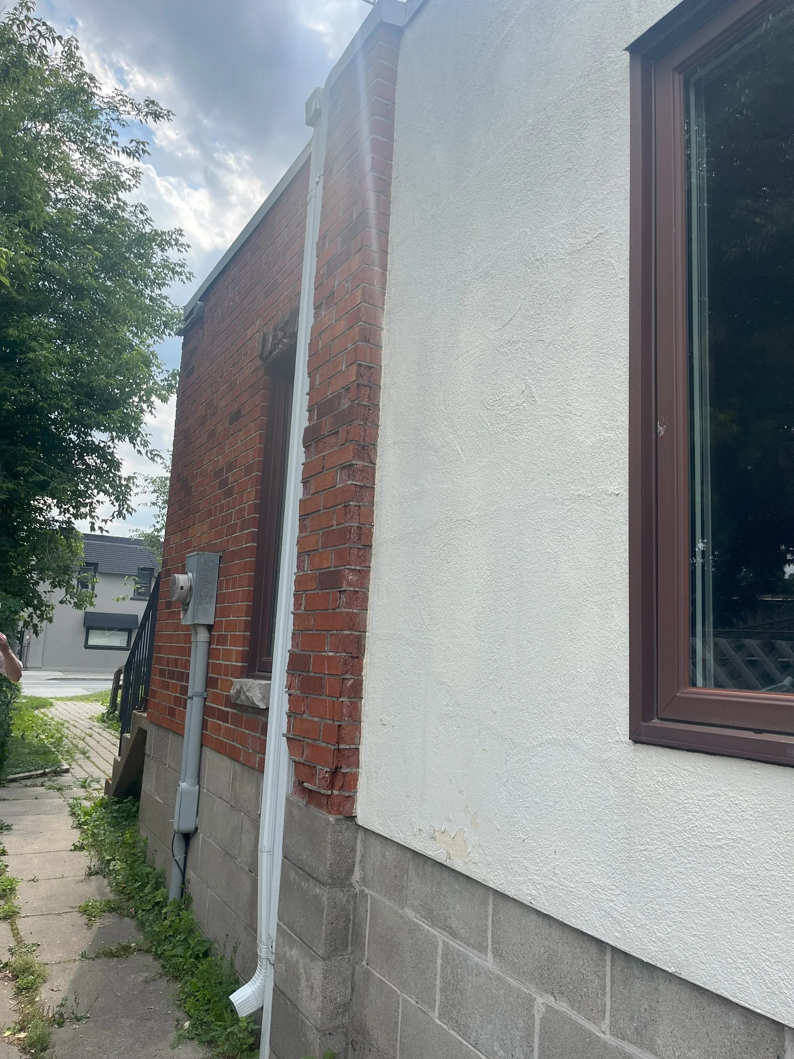 Brick wall area showing visible deterioration before restoration.