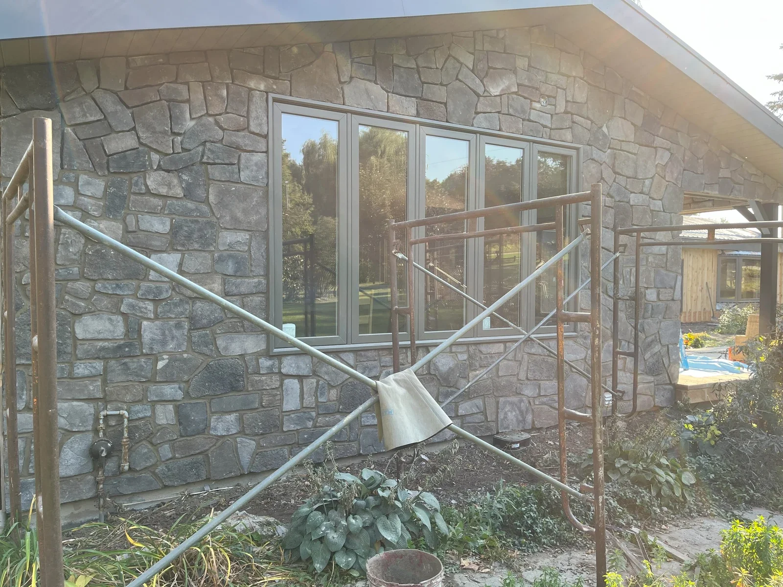 Exterior stone wall project with residential wall context.