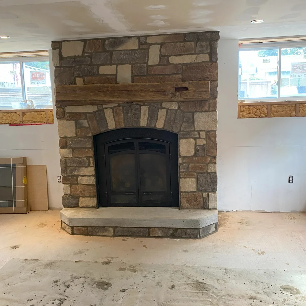 Finished interior stone fireplace wall with hearth detail