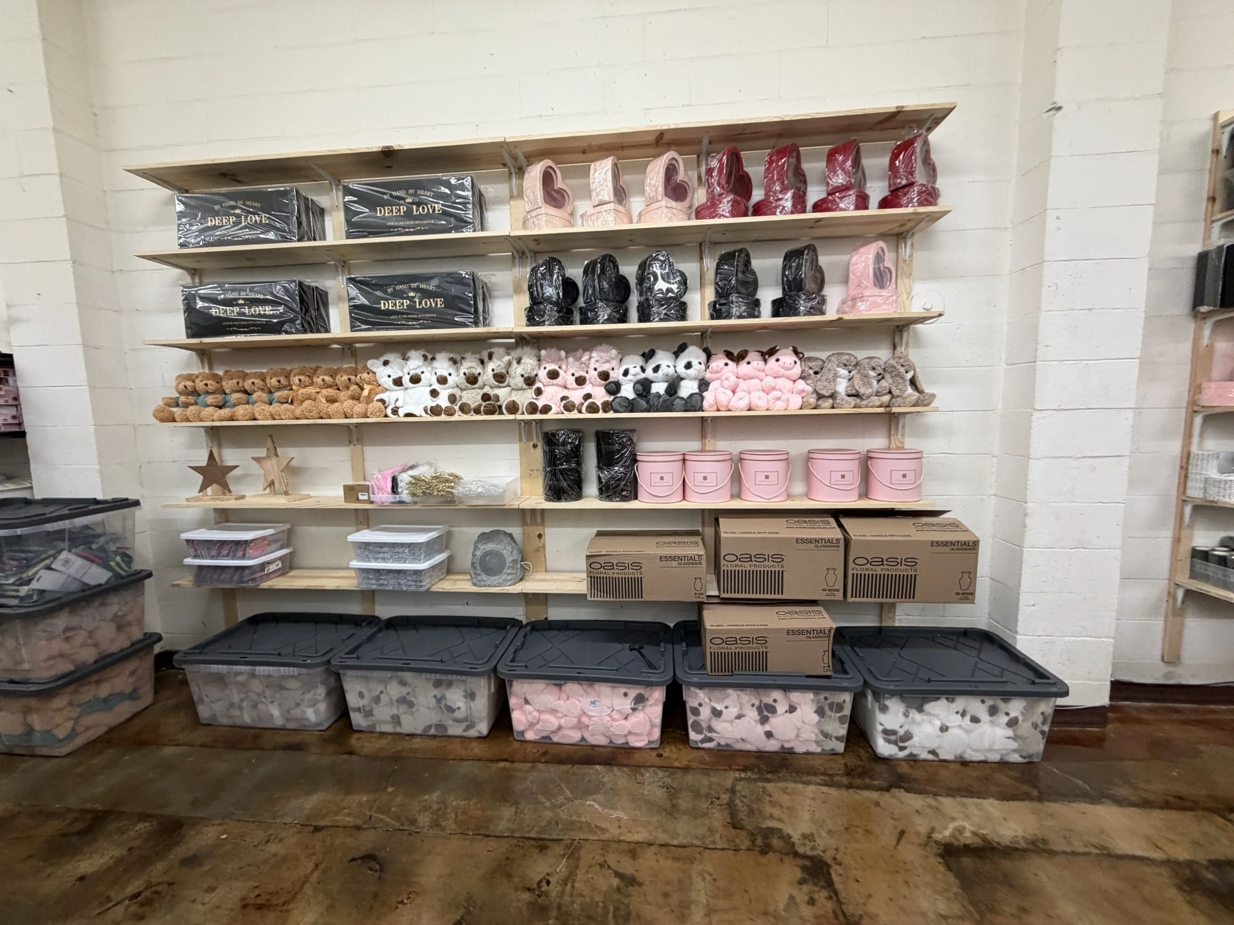 Floral supplies, ribbons, containers and gifts on shelves at The Strike Team Flowers in Concord.
