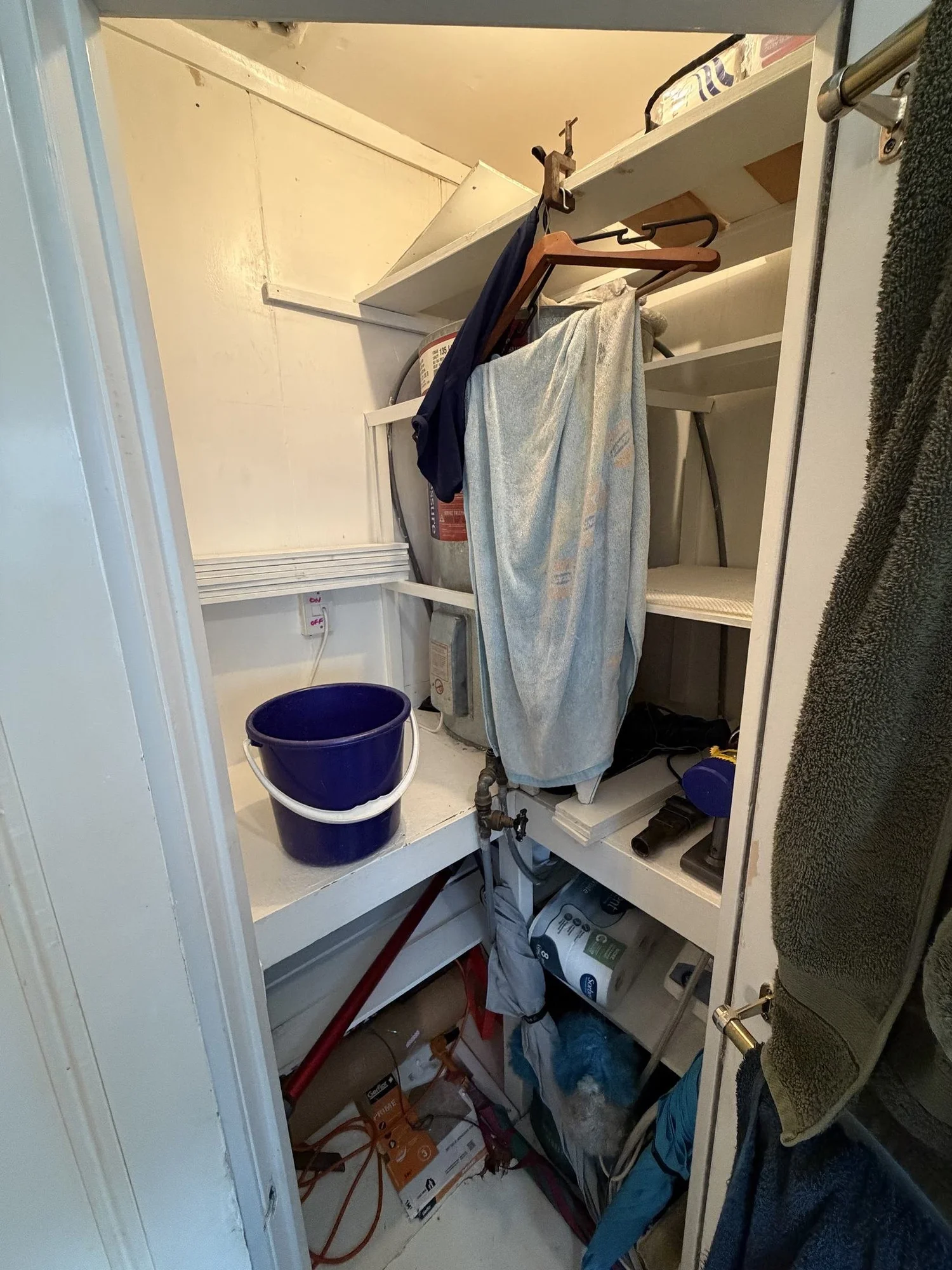 The old cluttered airing and hot water cylinder cupboard before it became a laundry, Parnell