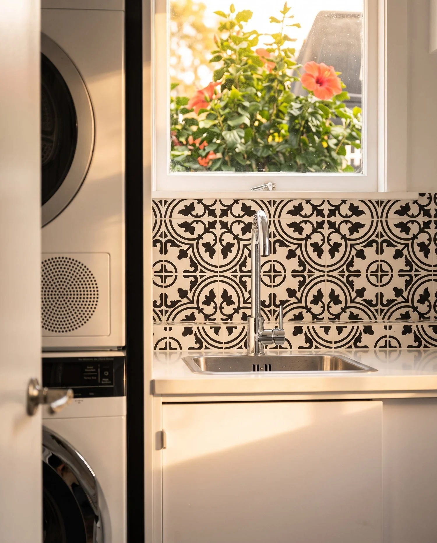 Stacked washer and dryer beside the window in the finished Merani Street laundry, Belmont