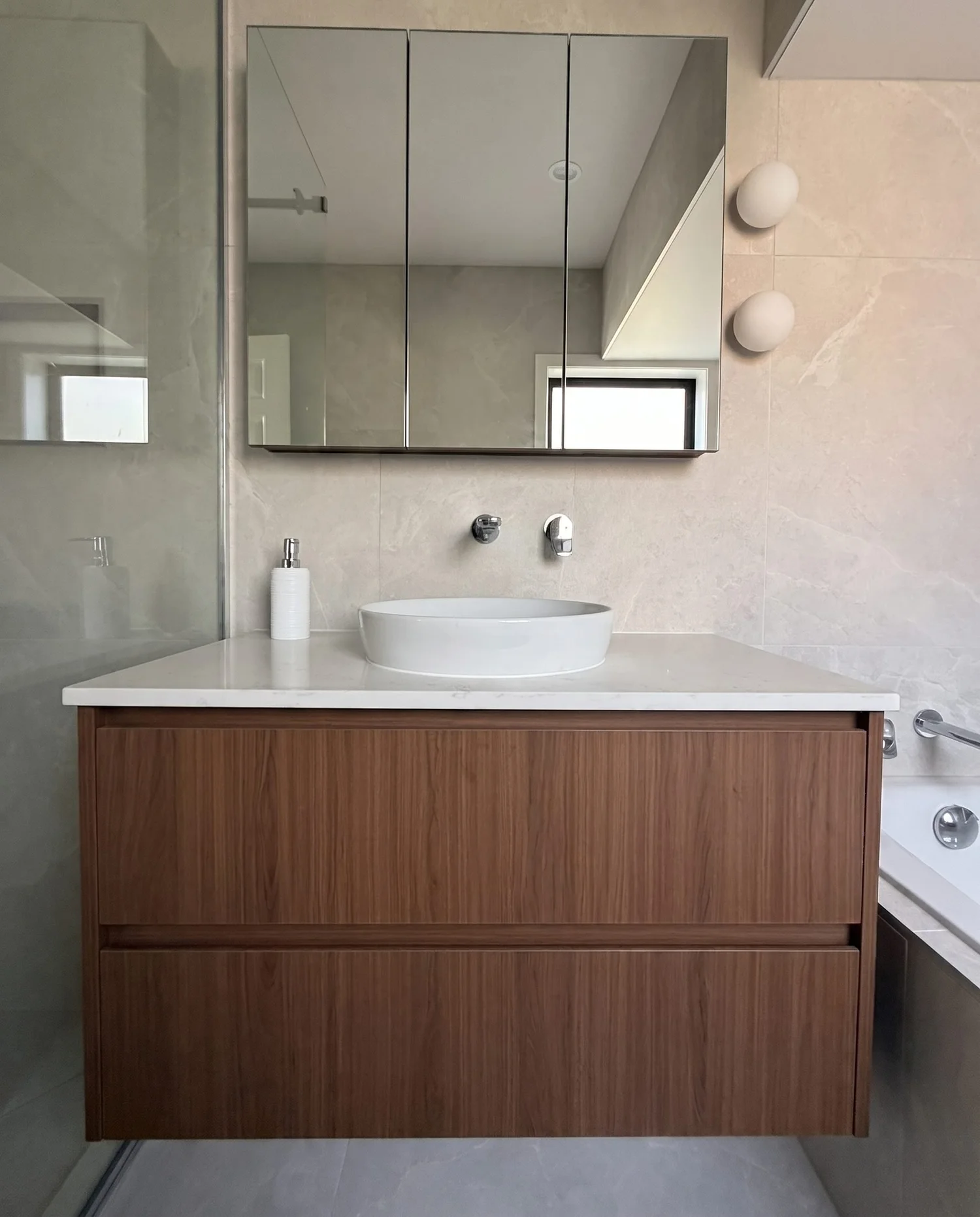 Walnut floating vanity and mirror cabinet in the Greenhithe family bathroom renovation