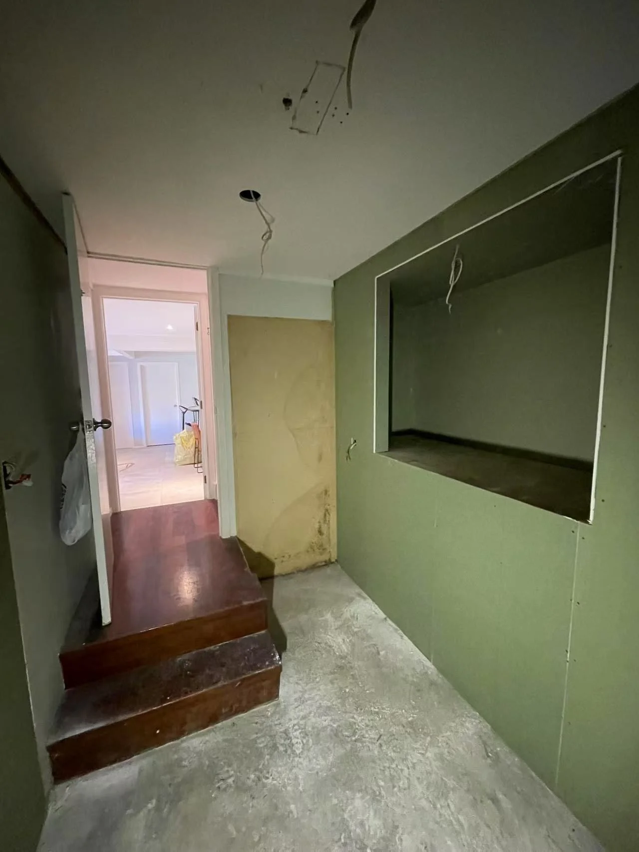 New wet-area board lining in the Rarangi Road laundry, St Heliers, with the display recess framed out