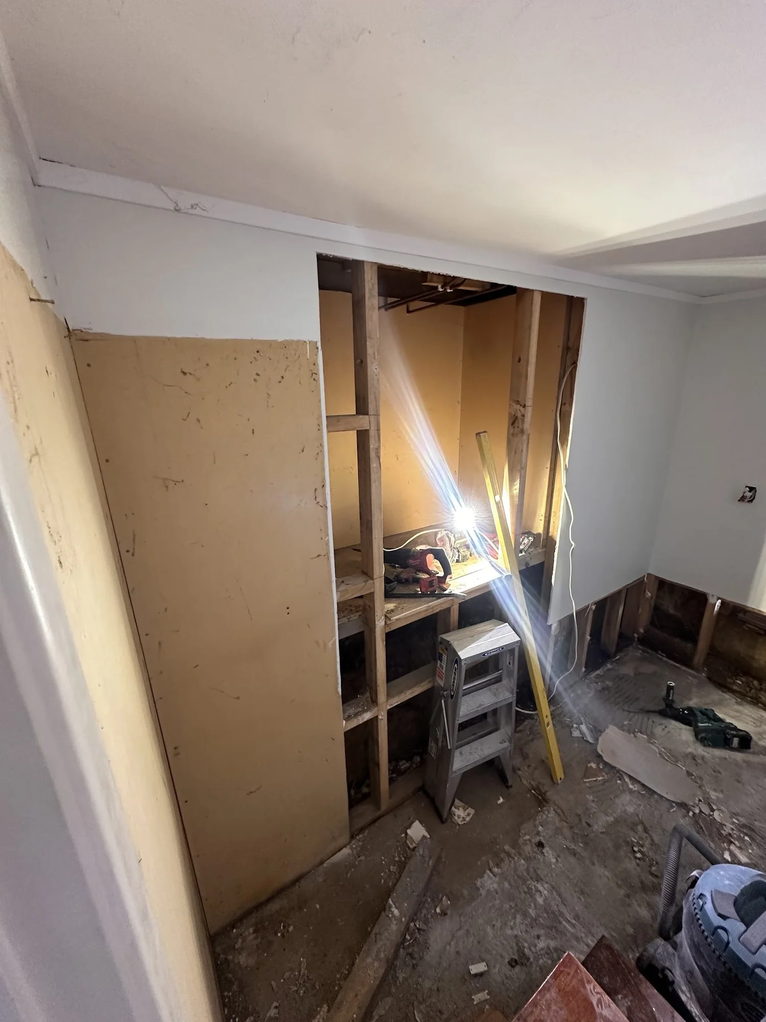 The hatch wall opened right up to the studs during the Rarangi Road laundry strip-out