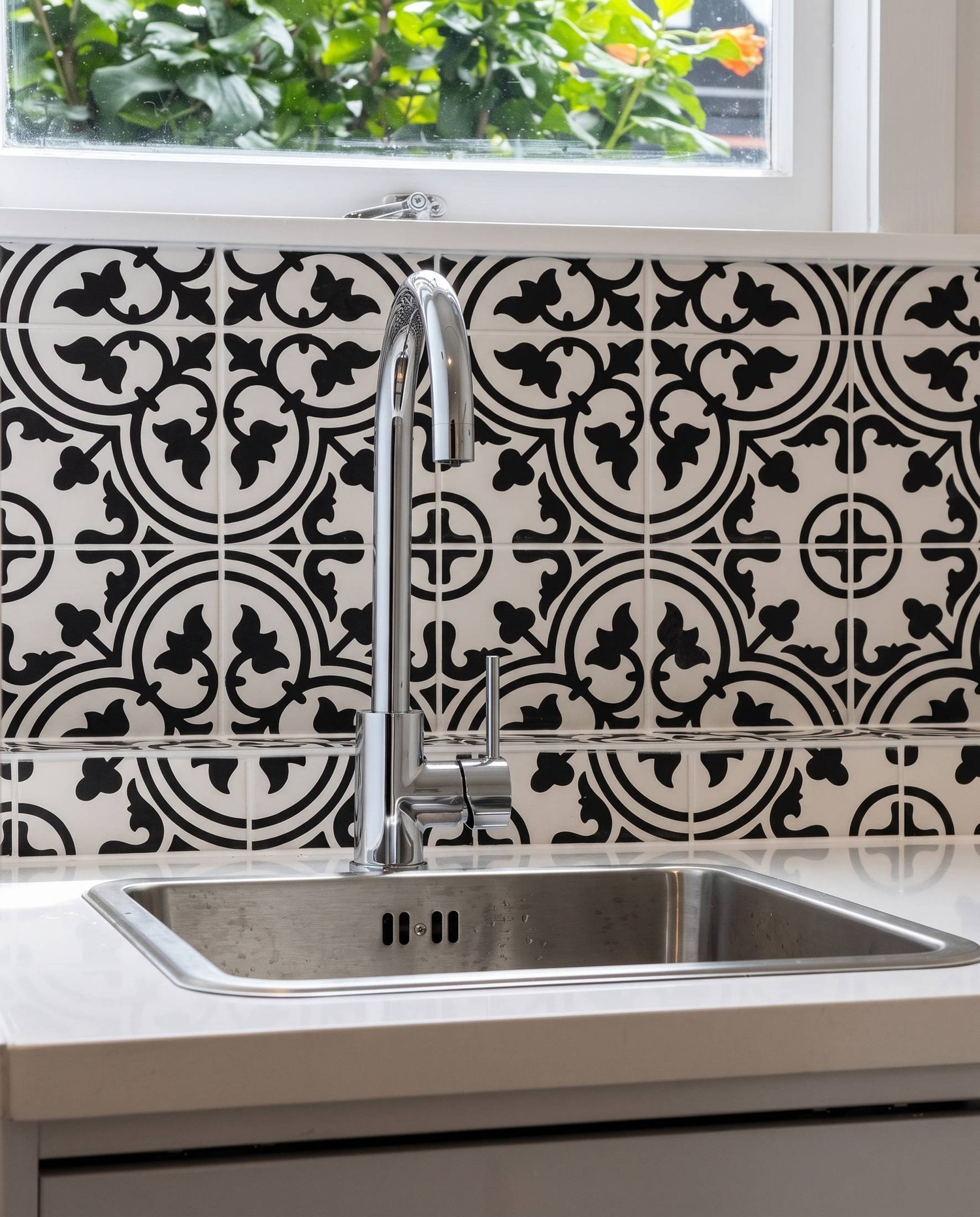 Stainless undermount sink, chrome gooseneck mixer and encaustic tile splashback, Belmont laundry