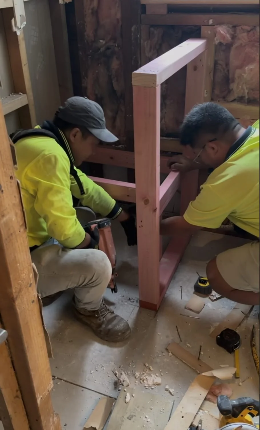 Builders framing a new wall during the Garfield Street bathroom renovation in Parnell, Auckland