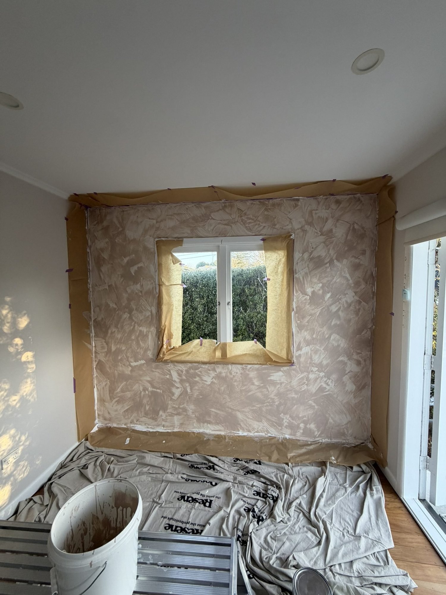 Kitchen wall taken back to substrate and masked during the Merani Street renovation, Belmont