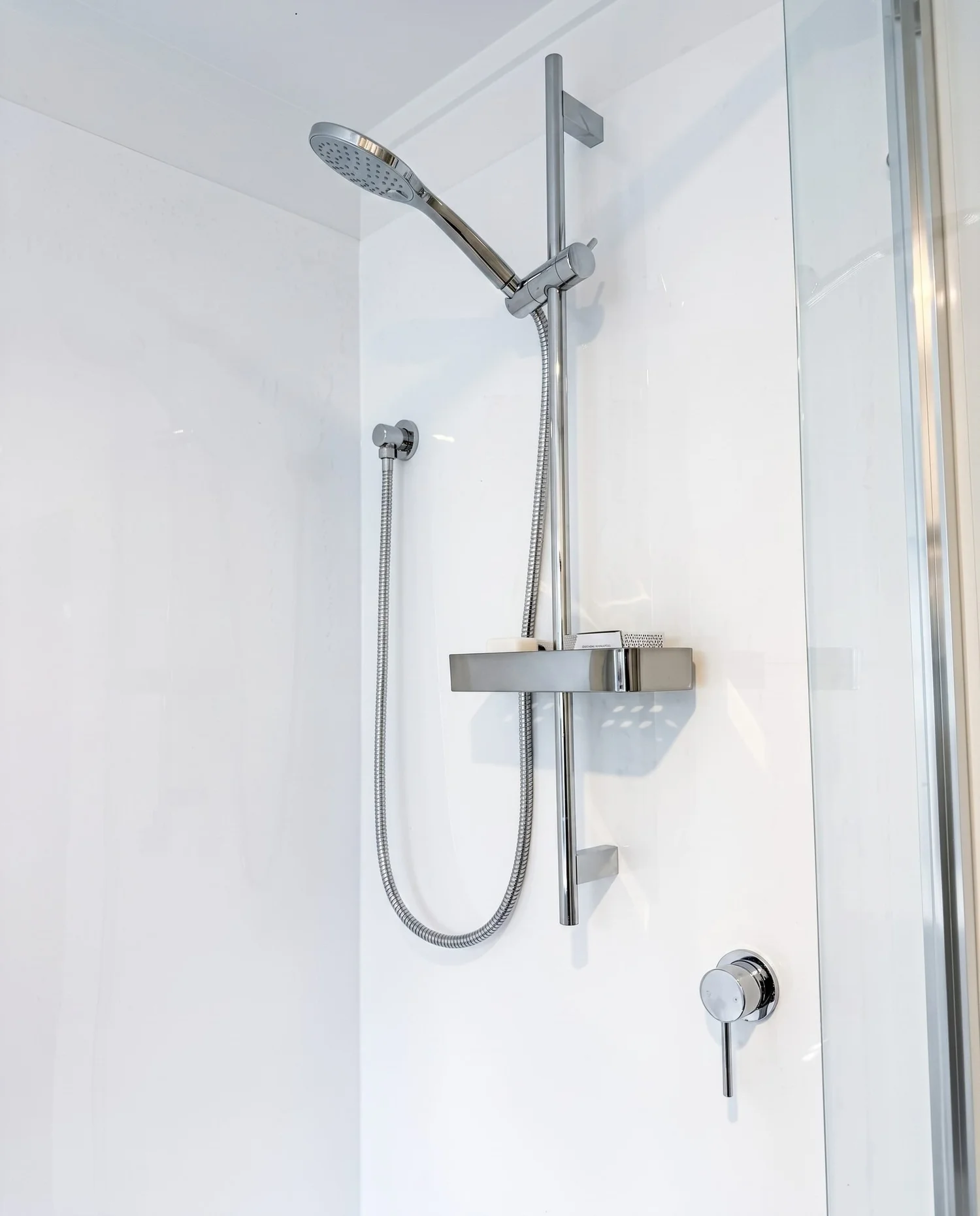 Frameless glass shower with chrome rail shower in the Merani Street laundry bathroom, Belmont