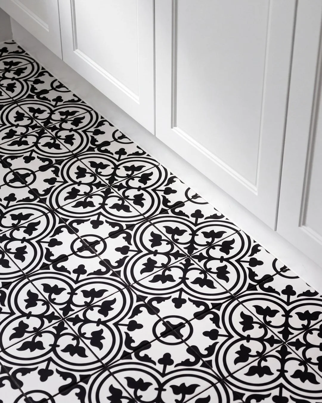 Black and white encaustic pattern floor tile in the Seymour Street laundry, St Marys Bay