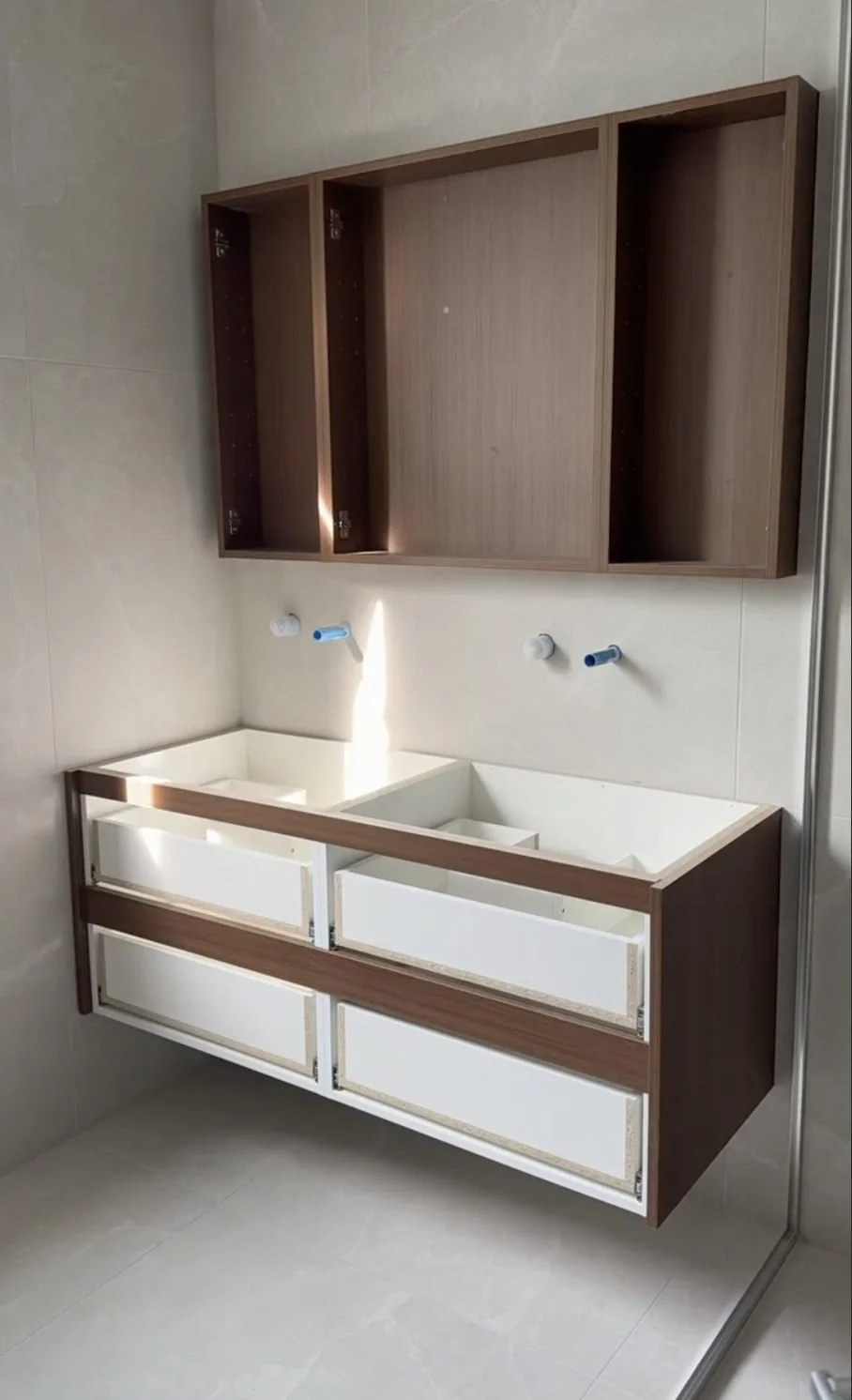 Walnut double vanity and mirror cabinet installed in the Greenhithe master bathroom renovation