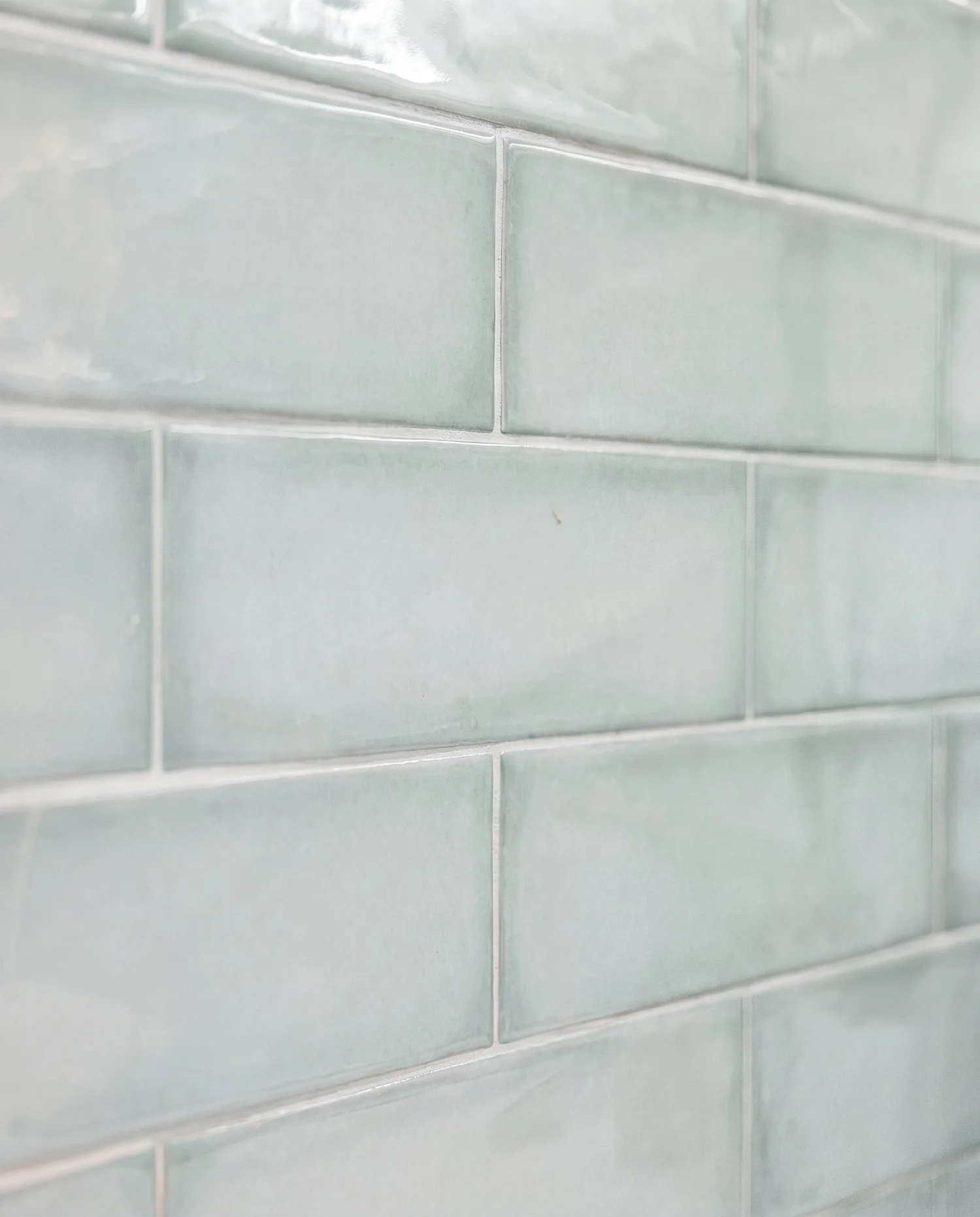 Sage green gloss handmade subway tile detail in the Rarangi Road laundry, St Heliers
