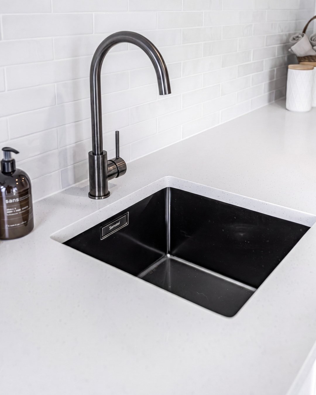 Black undermount sink and gunmetal mixer detail, St Marys Bay laundry renovation