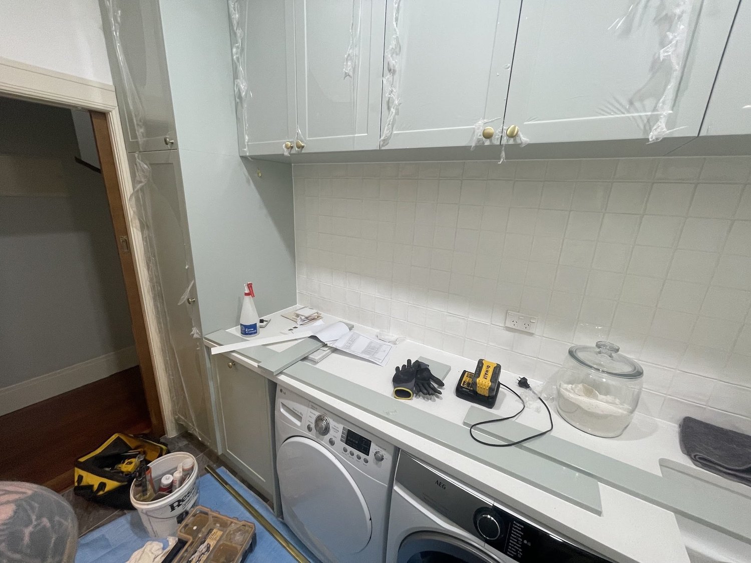 White square tile splashback complete in the Bayswater laundry renovation