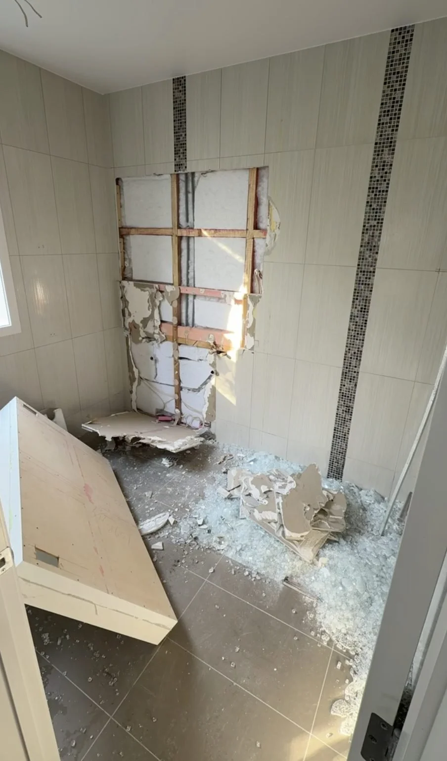 Demolition underway in the Churchouse Road master bathroom, Greenhithe, with the old tile coming off the wall