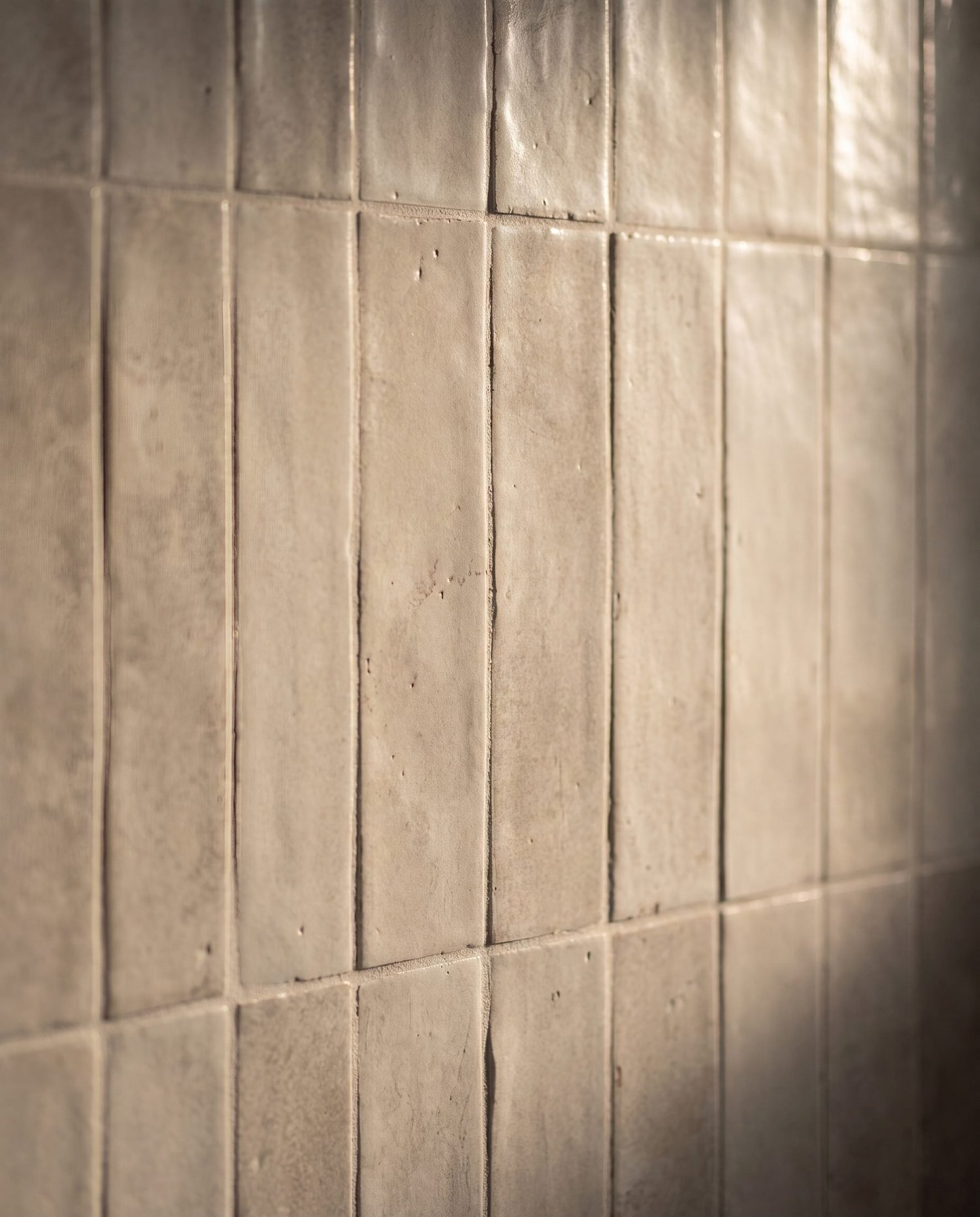 Grey vertical stack-bond tile texture and handmade-look glaze, Garfield Street bathroom renovation Parnell