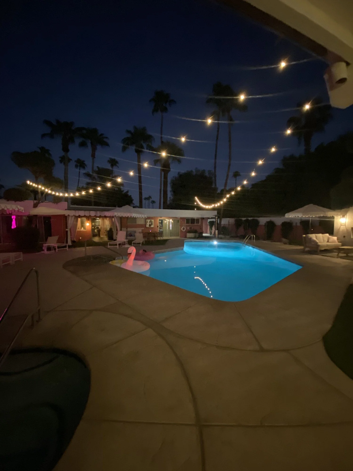 The courtyard pool glowing at night