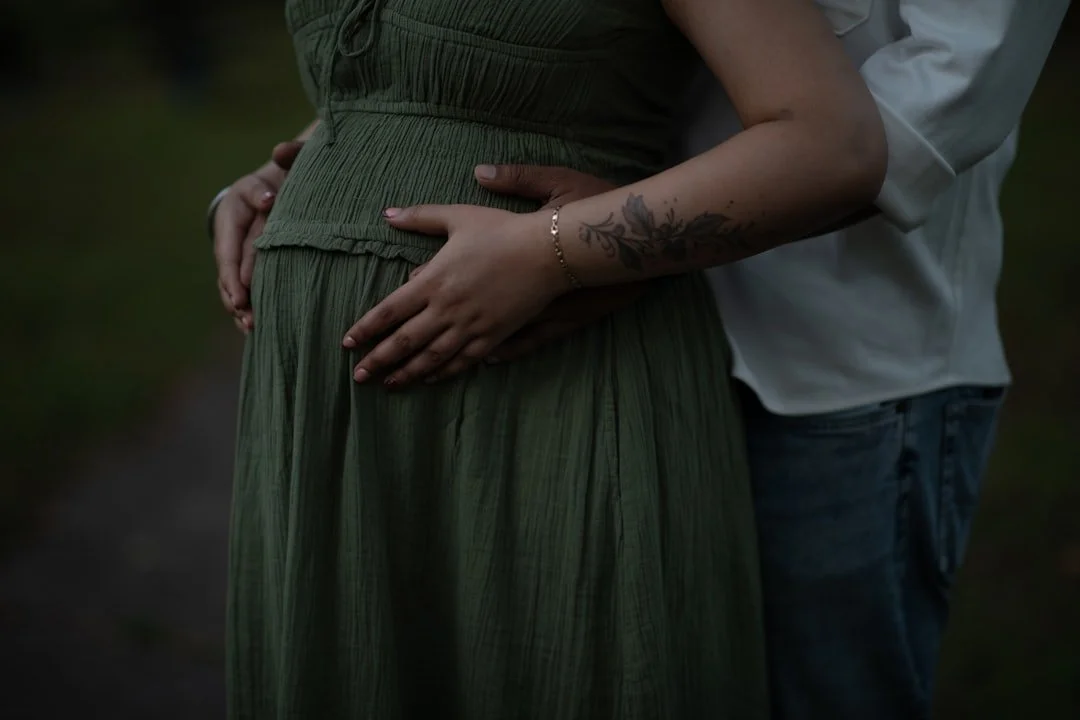 Pregnant woman smiling and relaxed after chiropractic care in Petaluma