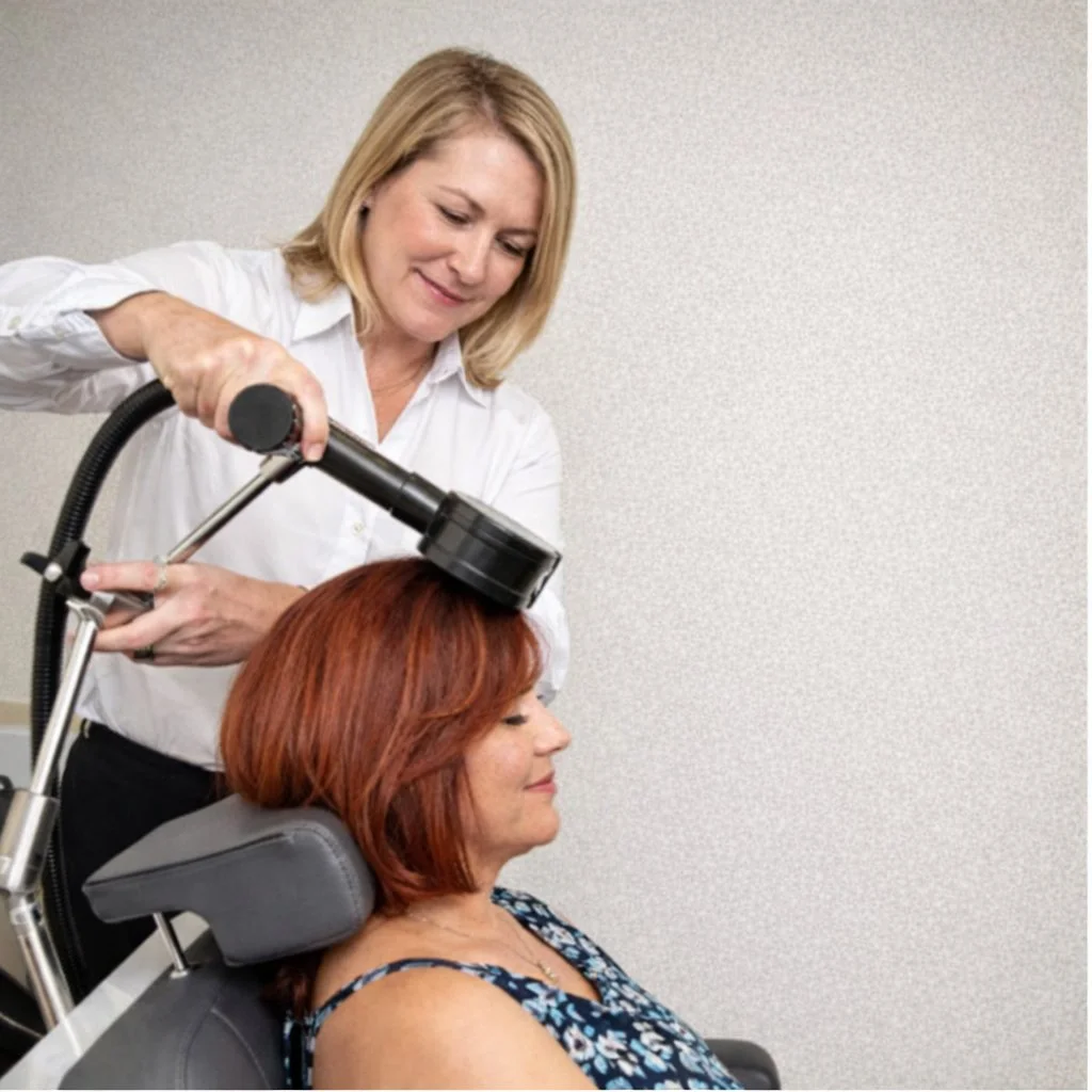 Patient receiving PrTMS treatment for chronic migraine