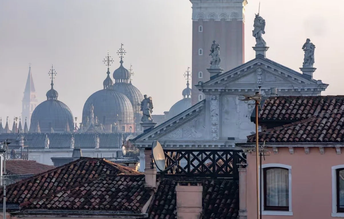 San Marco domes and Venetian rooftops at dawn