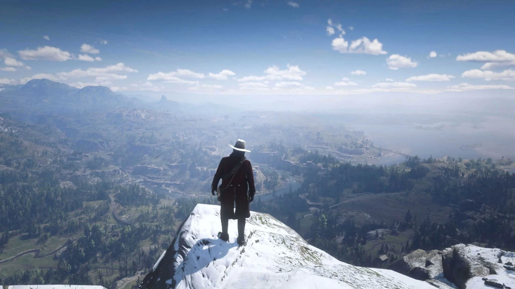 A sweeping vista from the top of Mount Shann in Red Dead Redemption II
