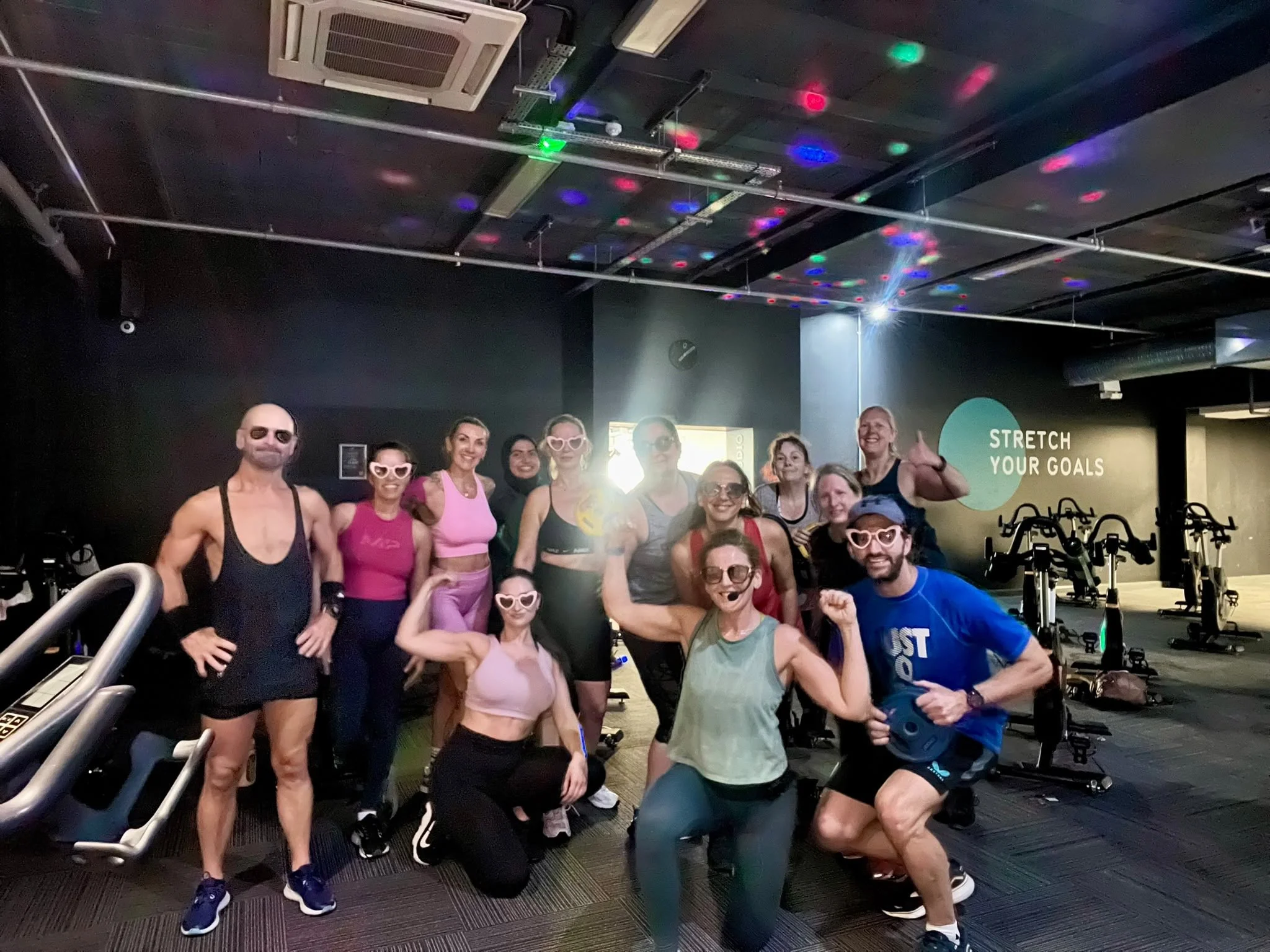 A group photo after a class in the spin studio