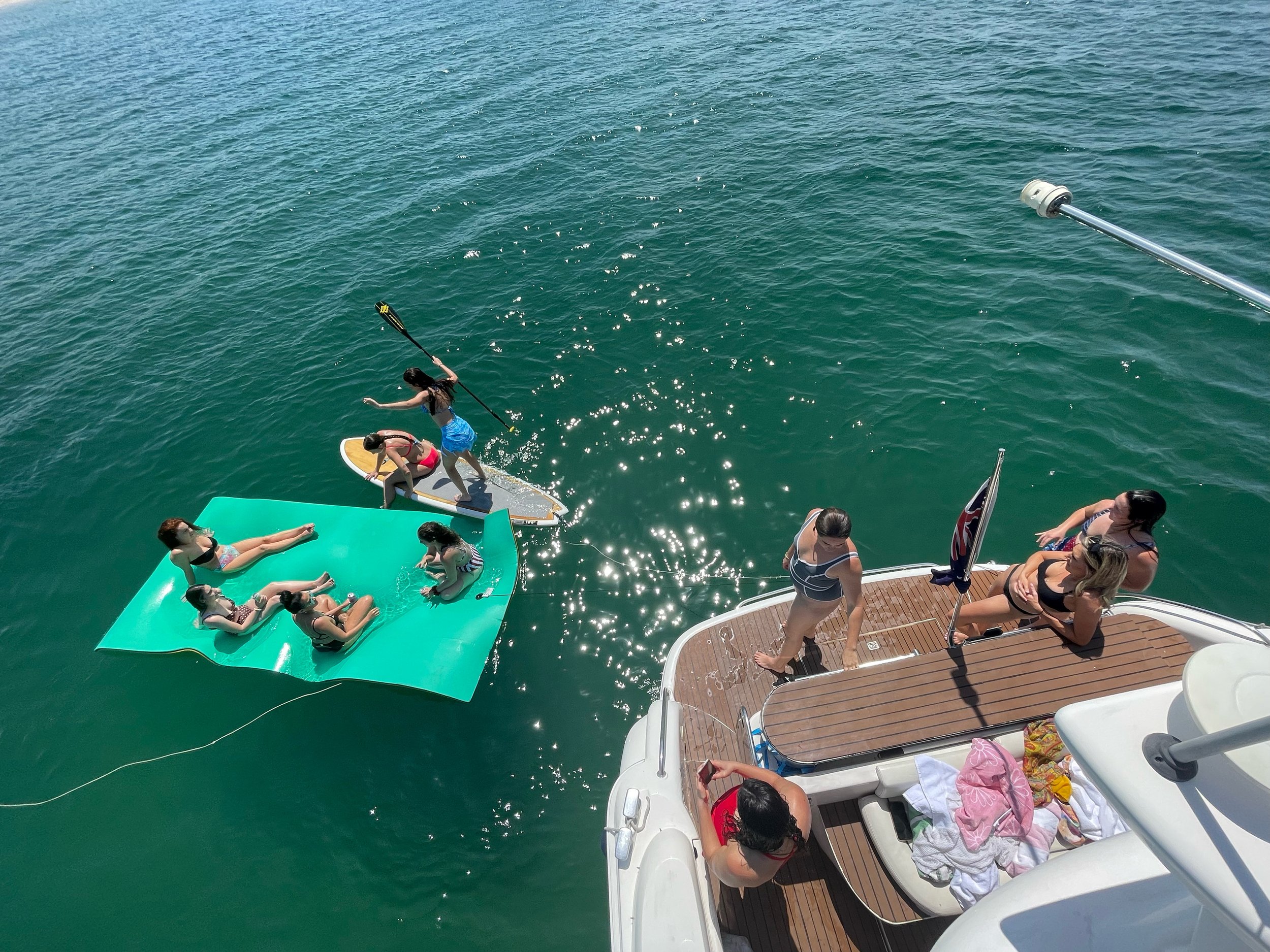 Family enjoying a swim stop on a Gold Coast cruise