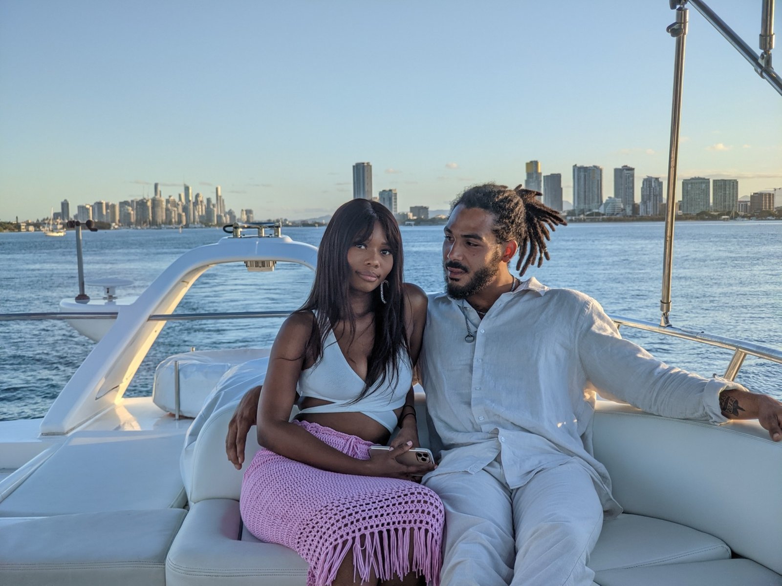 Couple sharing a romantic moment aboard private yacht
