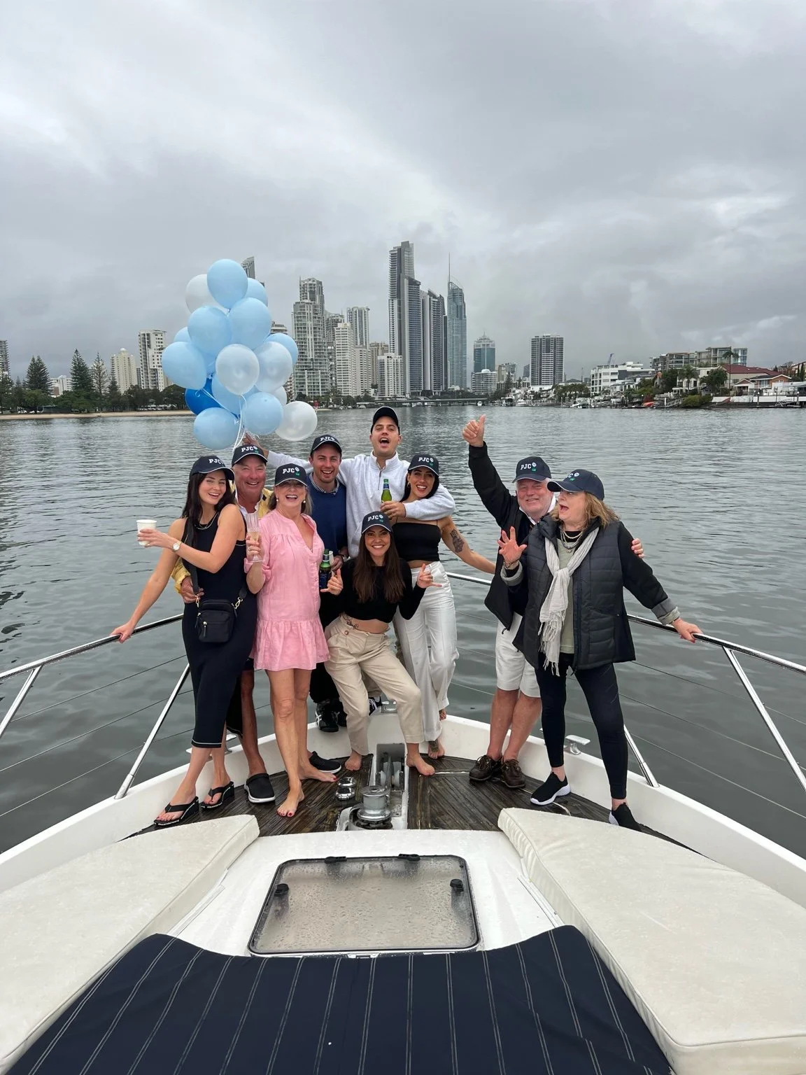 Corporate group aboard Inspiration with the Surfers Paradise skyline