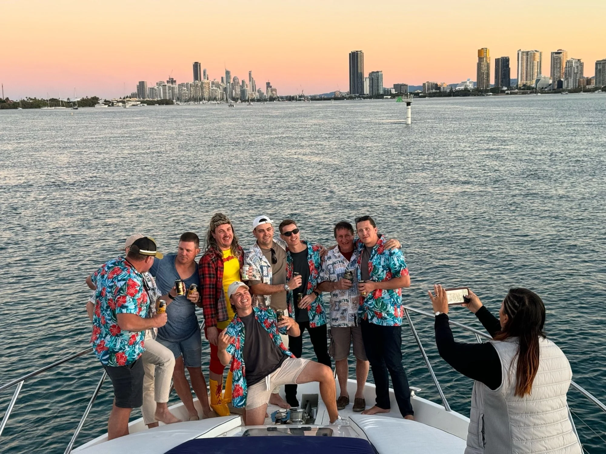 Friends celebrating golden hour on a Gold Coast sunset cruise