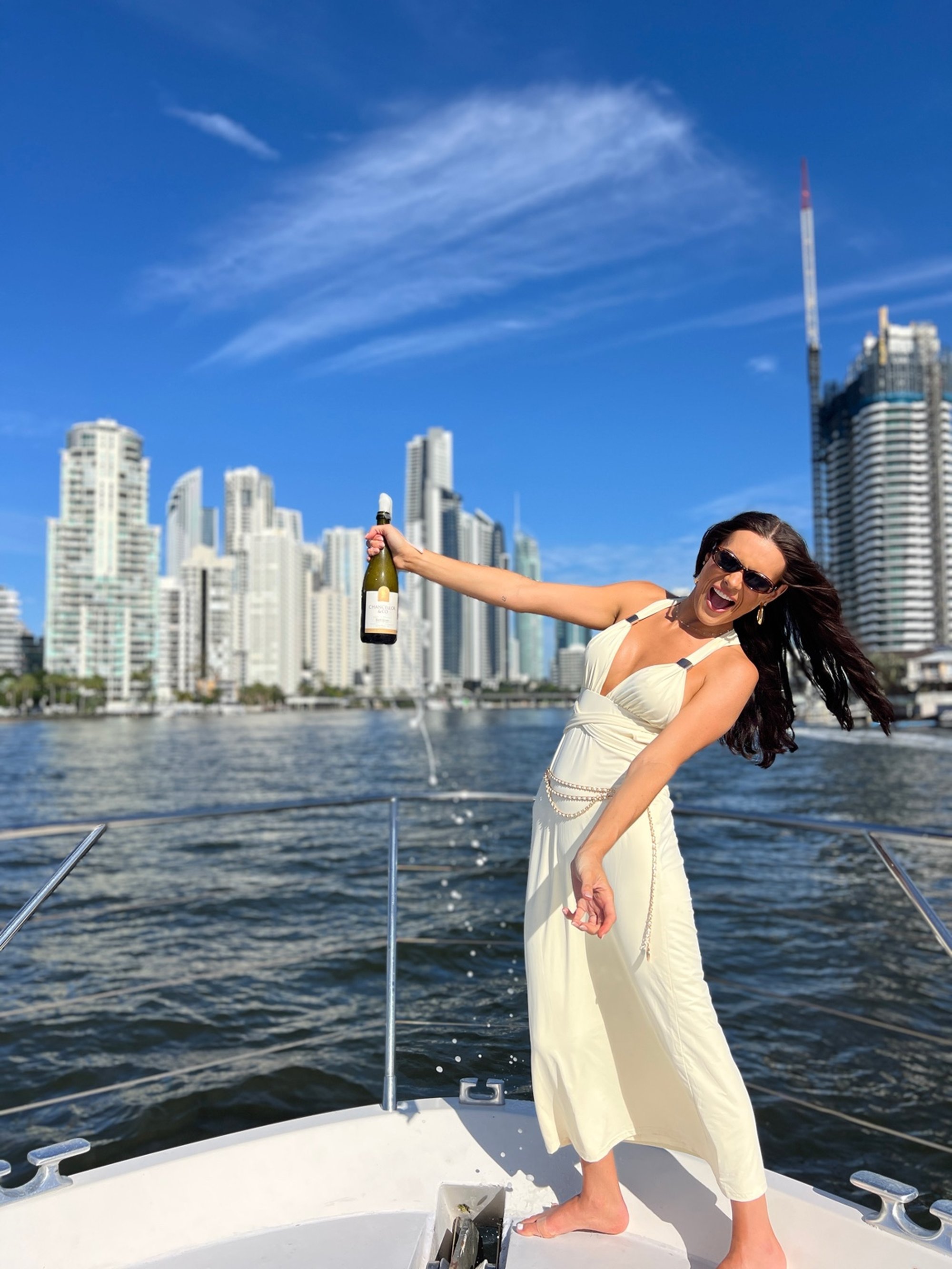 Group celebrating on deck during festive Gold Coast cruise