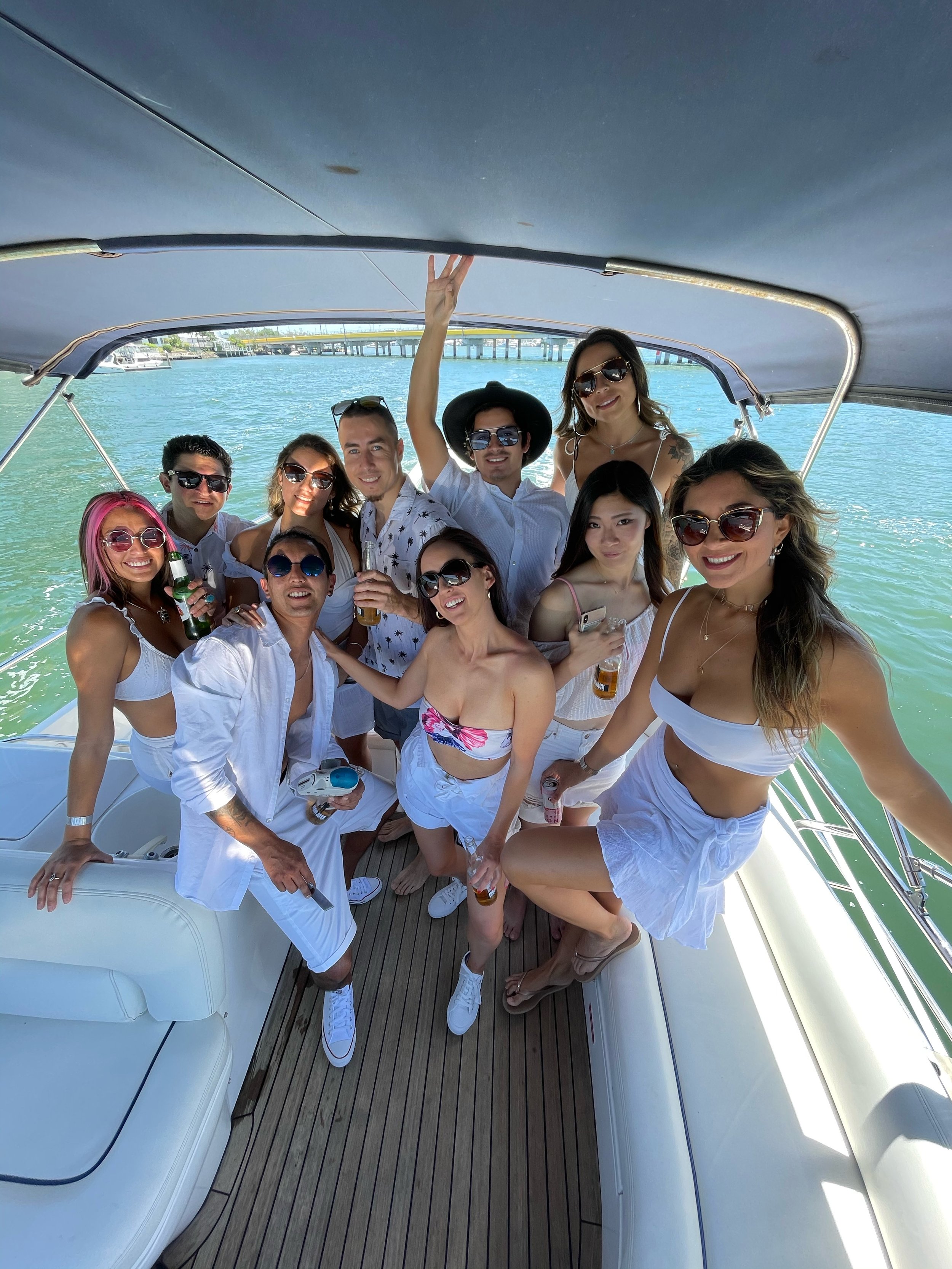 Group enjoying a boat party along the Nerang River on New Year's Eve