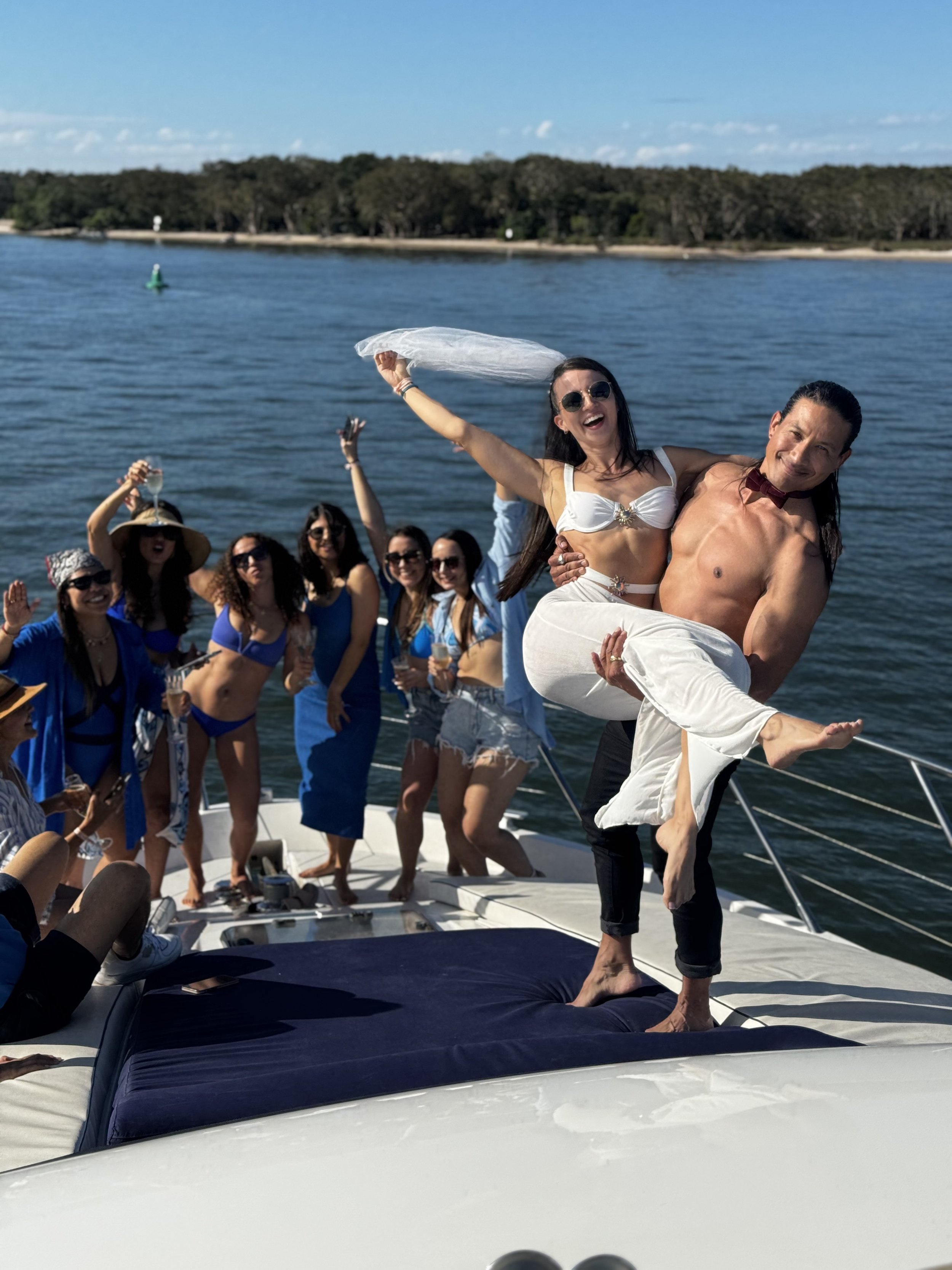 Hens party group celebrating onboard yacht
