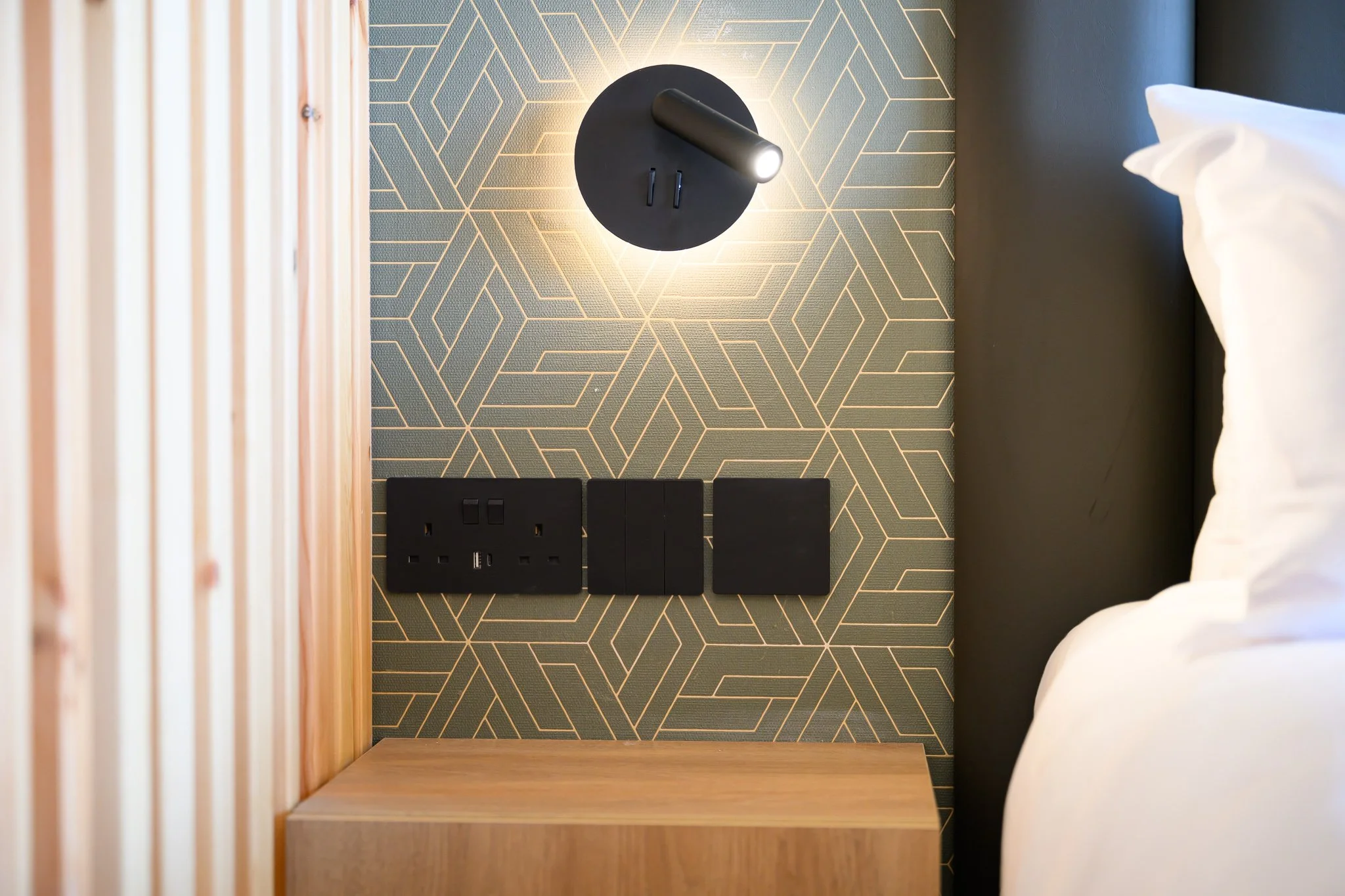 Nisia Junior Suite amenity — Bedside USB-A, USB-C and sockets