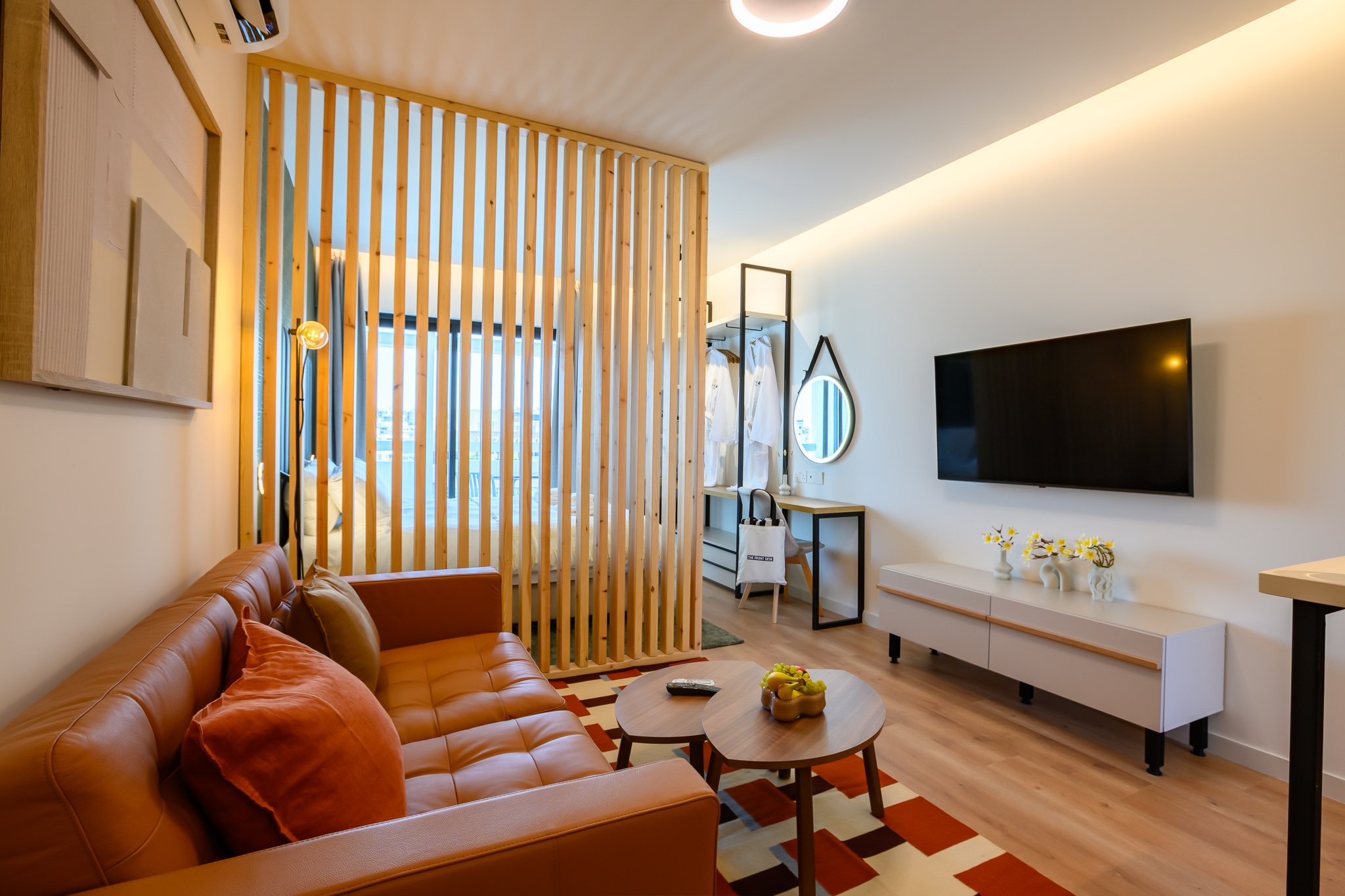 Nisia Junior Suite — Leather sofa and Smart TV