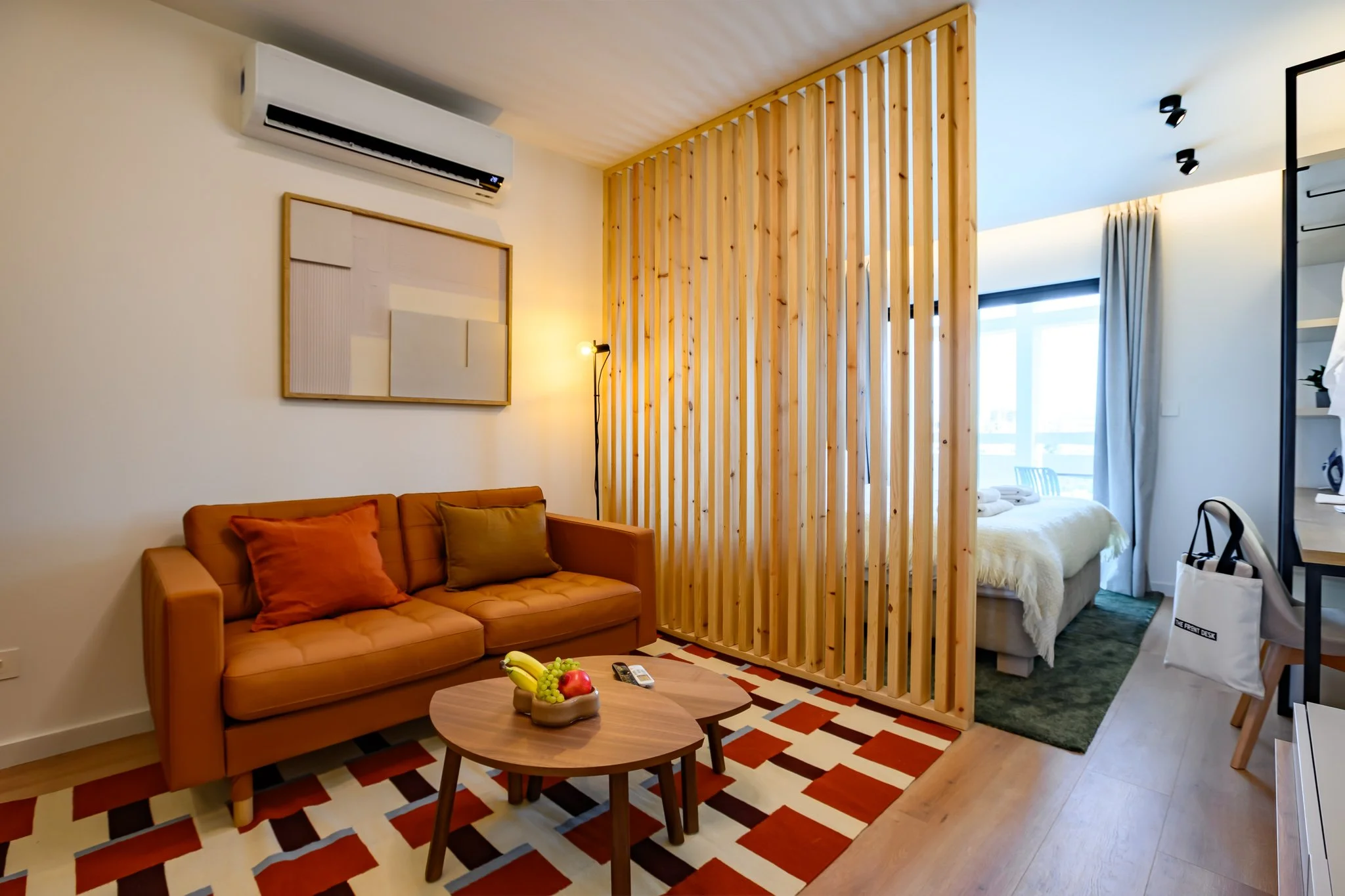 Nisia Suites Junior Suite sitting area with bedroom beyond, Nicosia