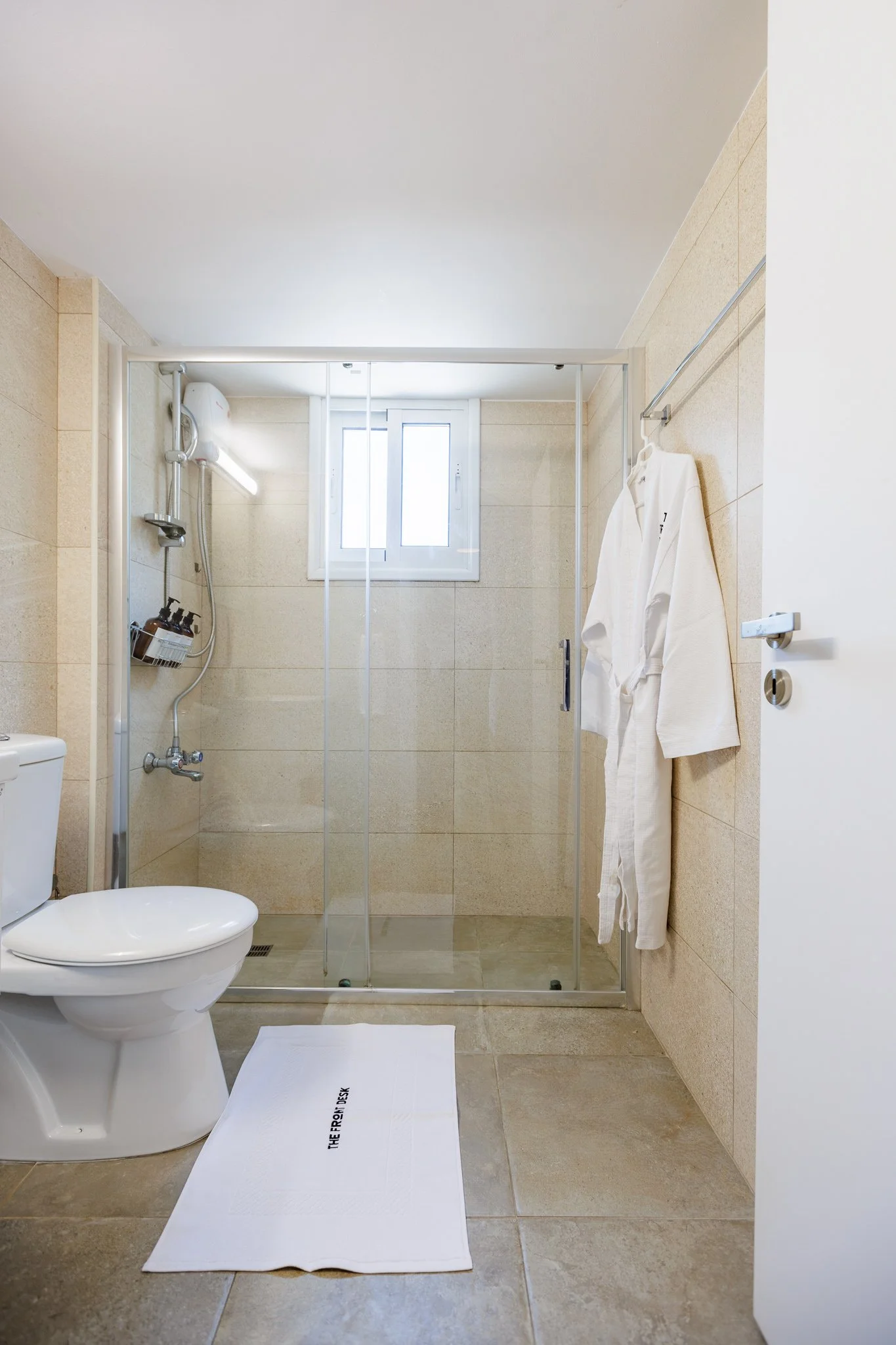 Antoinette Court — Walk-in shower and bathrobe