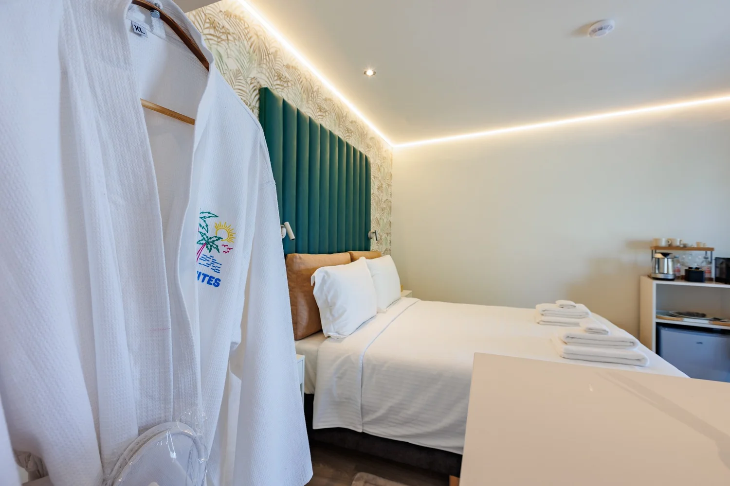 The Palm Suites Suite 2 — Bathrobes ready, bed made up