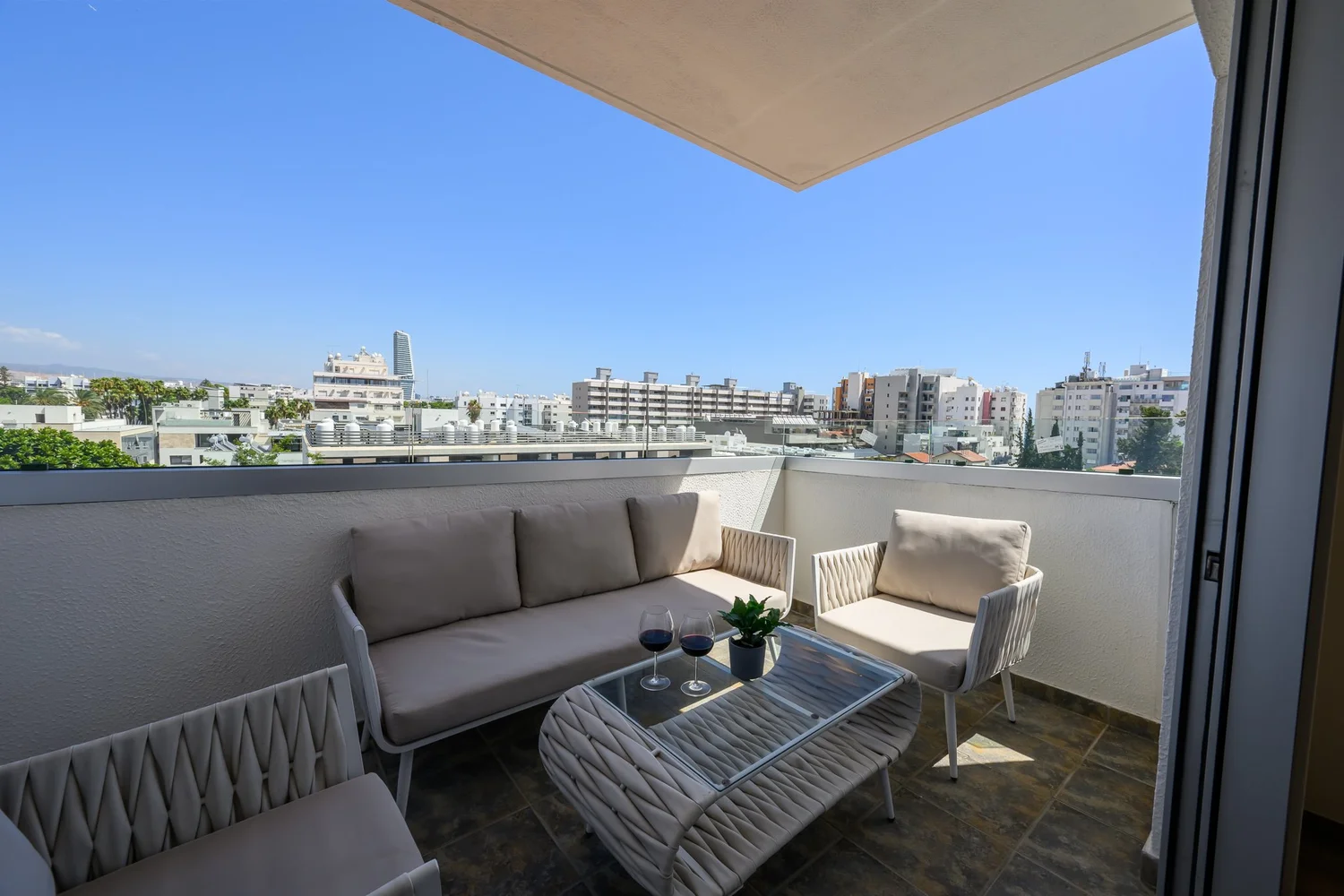 Calian Court — Private balcony with outdoor lounge