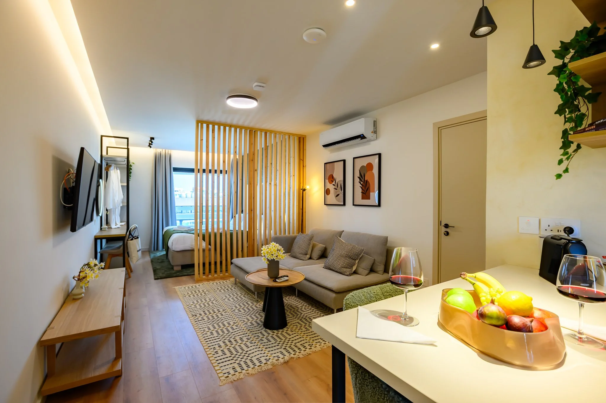 Nisia Suites Signature Suite open-plan living area and bedroom, Nicosia