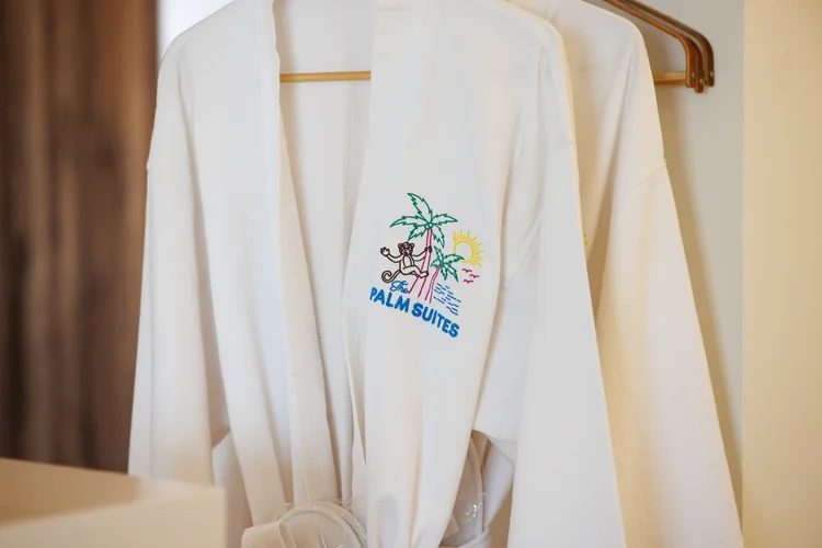 The Palm Suites — Palm Suites bathrobe