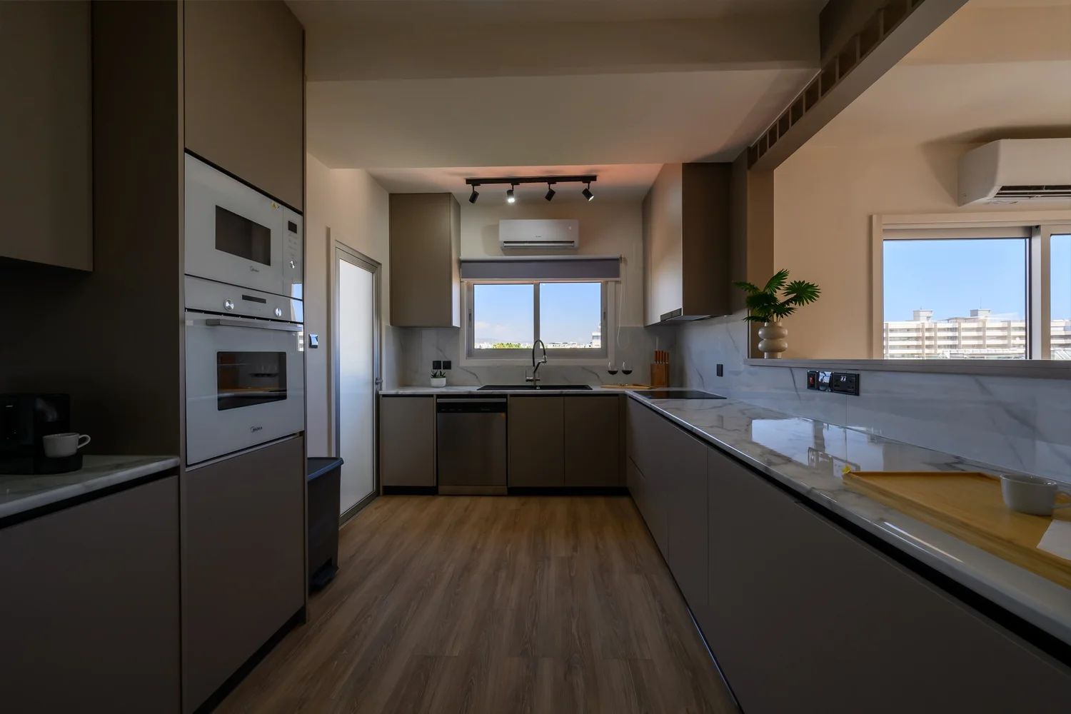 Calian Court — Kitchen through to the living room